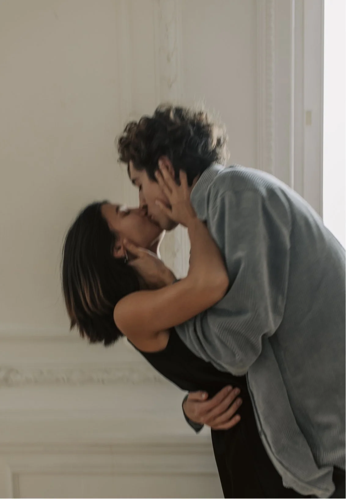 A couple sharing a passionate kiss, symbolizing stronger sex life and intimacy after the help of a couples therapist