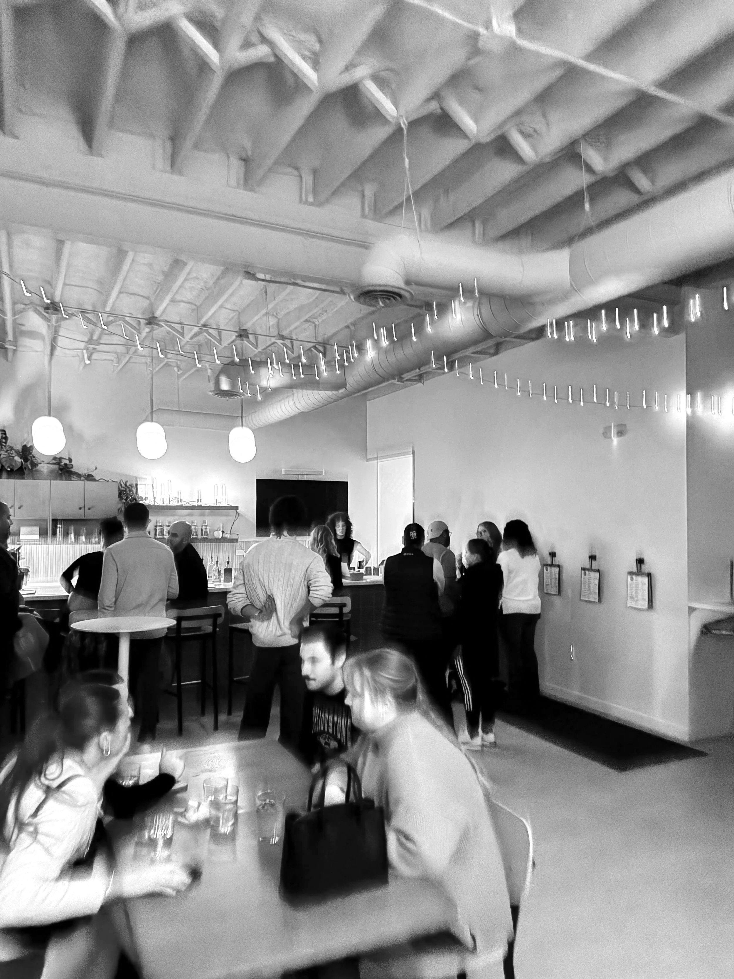 A picture of a lively environment around the main bar at Nord Social