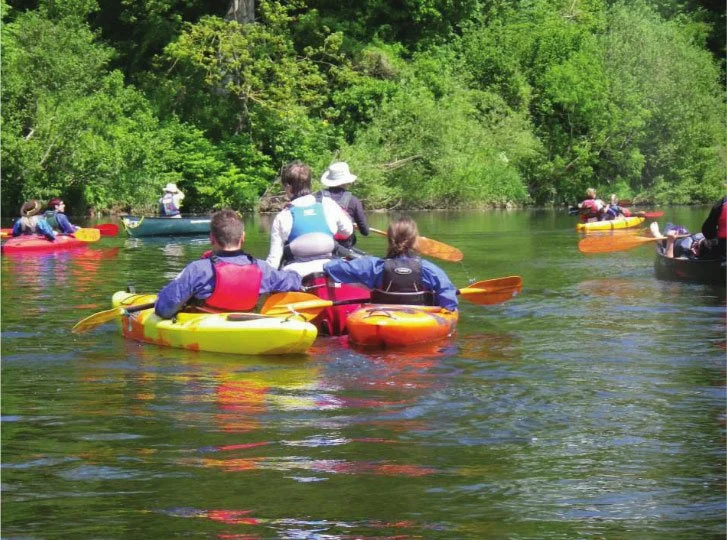 Mixed canoes and kayaks paddling on the WYe
