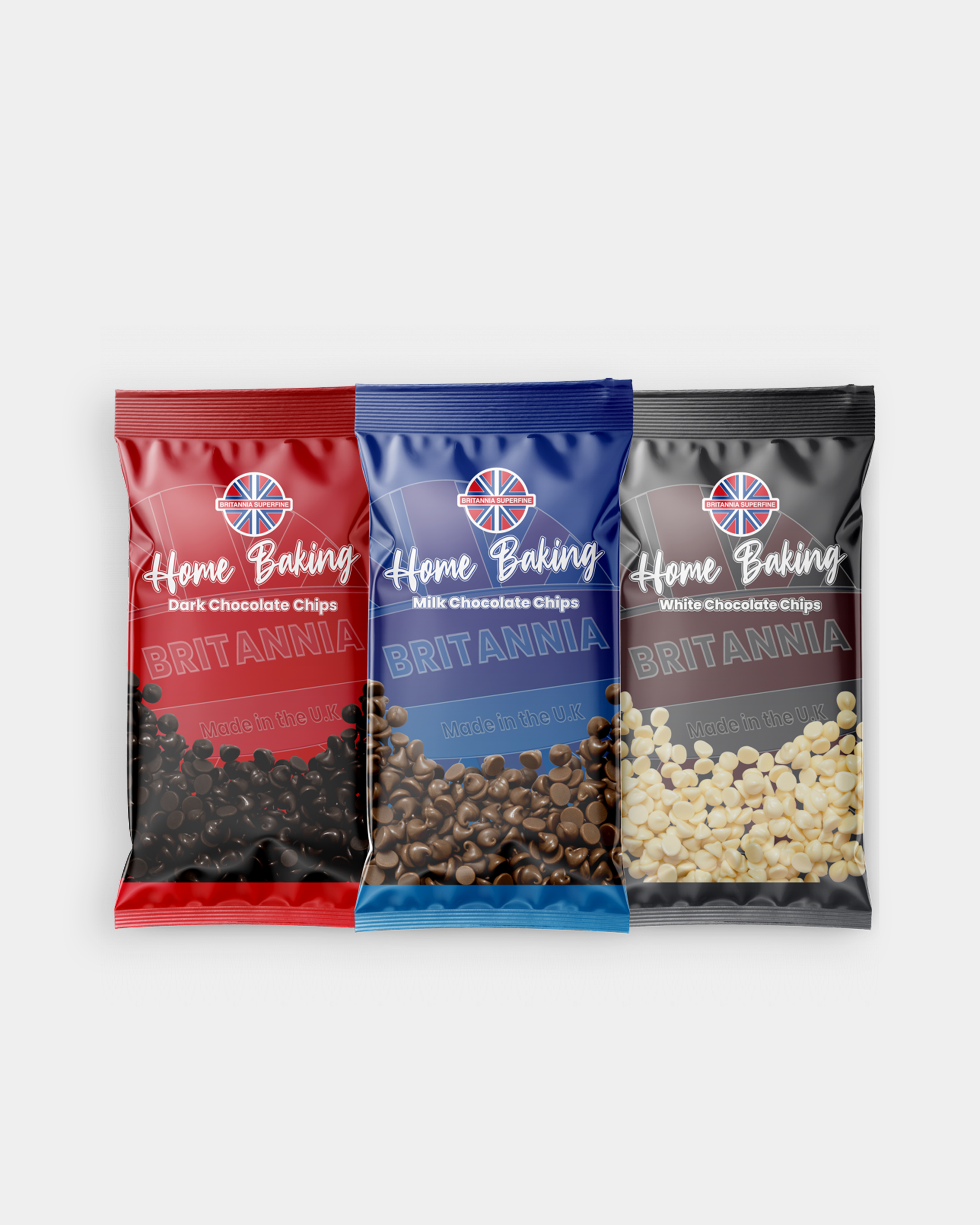 Three bags of Britania home baking chocolate chips, in red, blue, and black packaging for dark, milk, and white chocolate chips respectively.