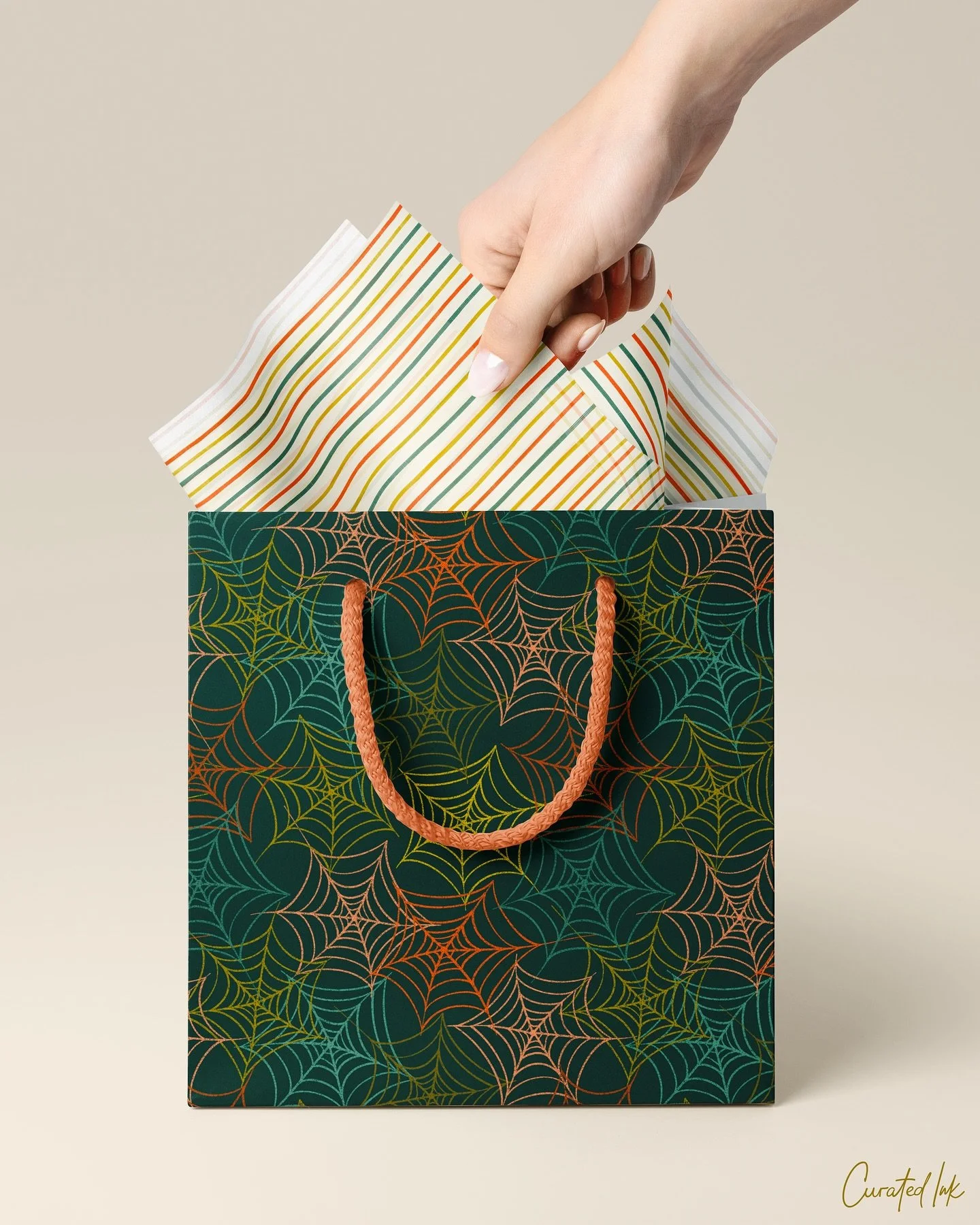 And now on a mockup!
I’m not usually a spooky fan, but I’d totally buy this colorful play on Halloween! Doesn’t this playful spider pattern add a fun twist to traditional Halloween gift bags? It would be perfect for brands looking