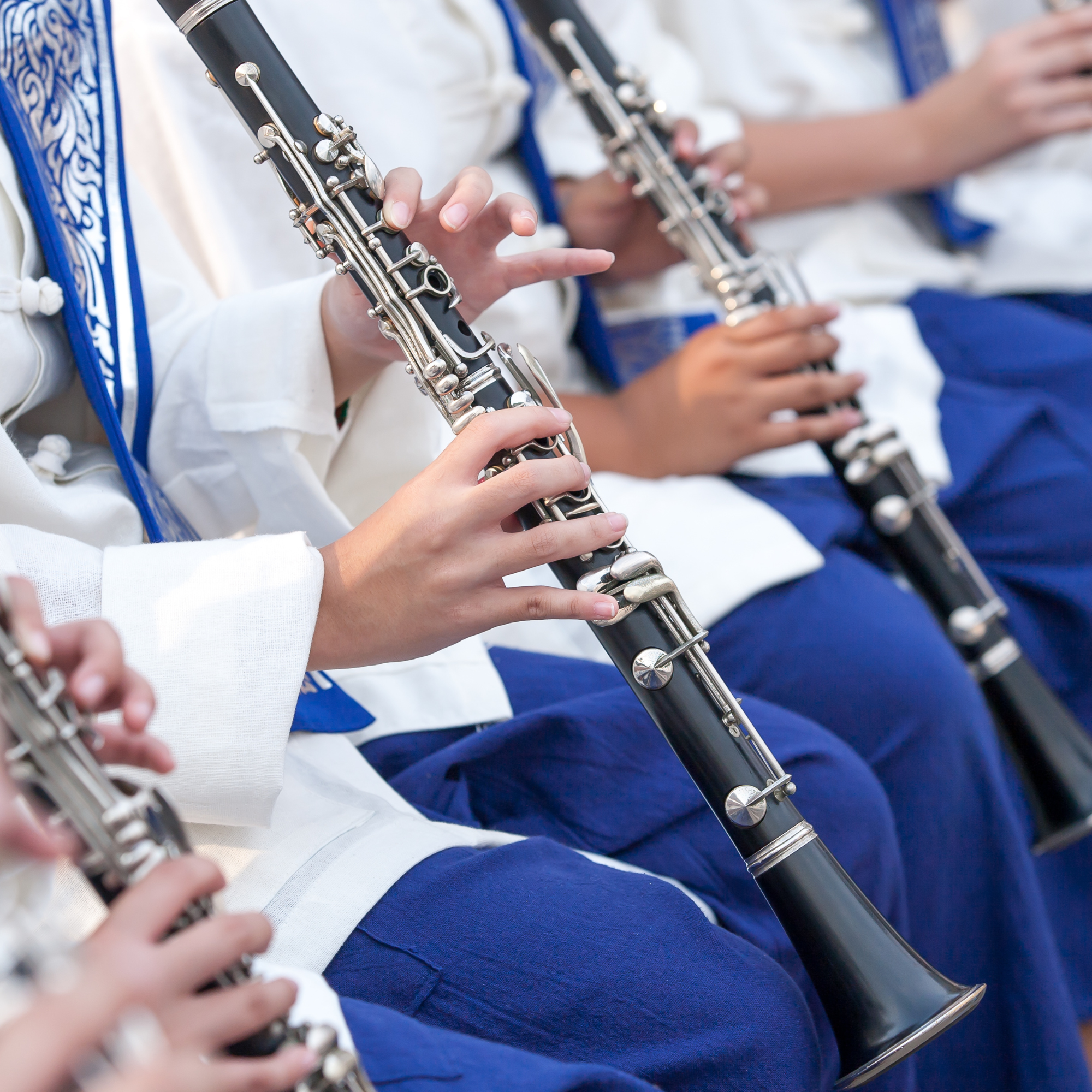 Group of students playing recorders during a music class.