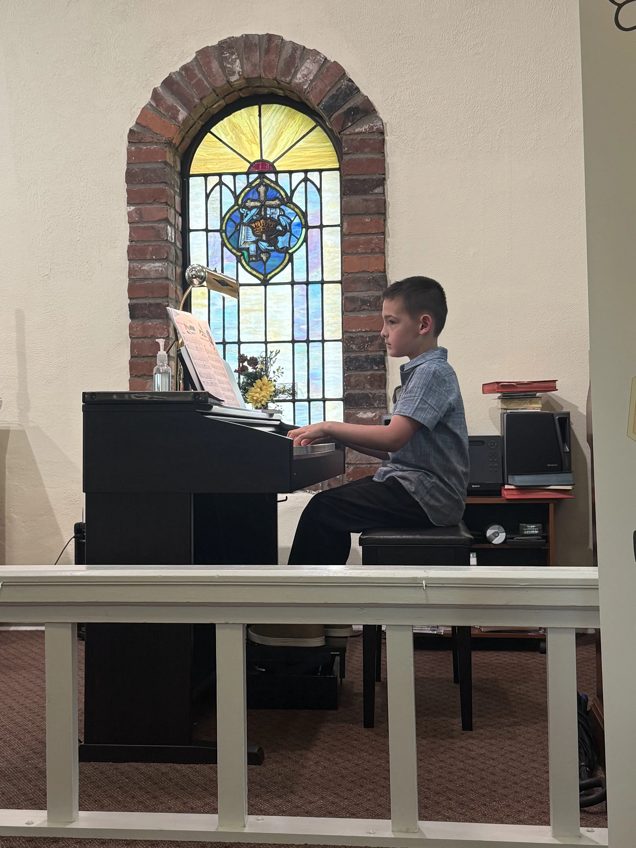 kid playing piano