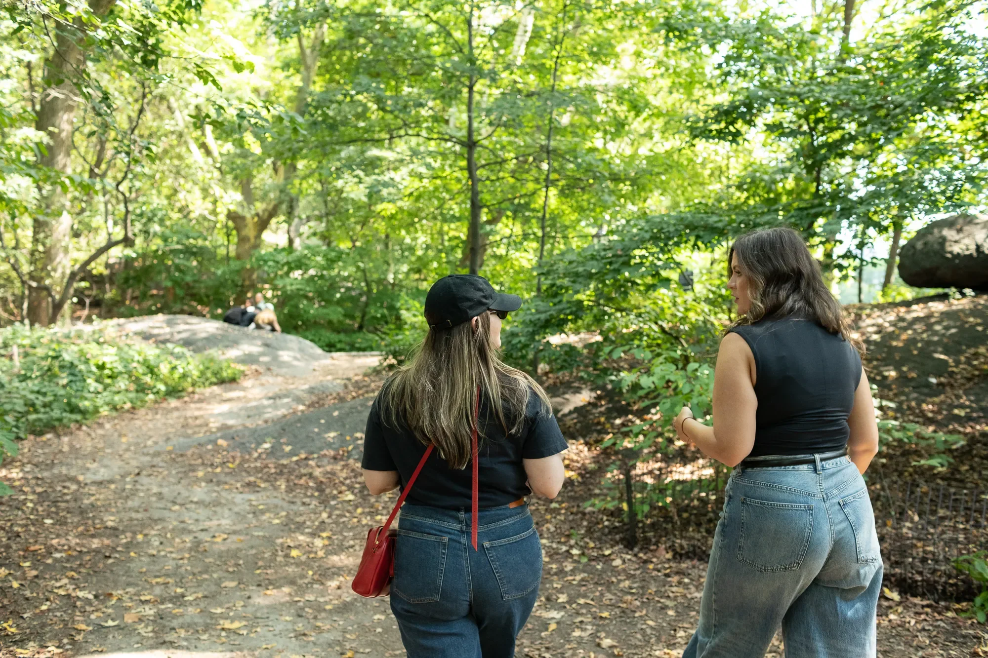 two women walking in a park