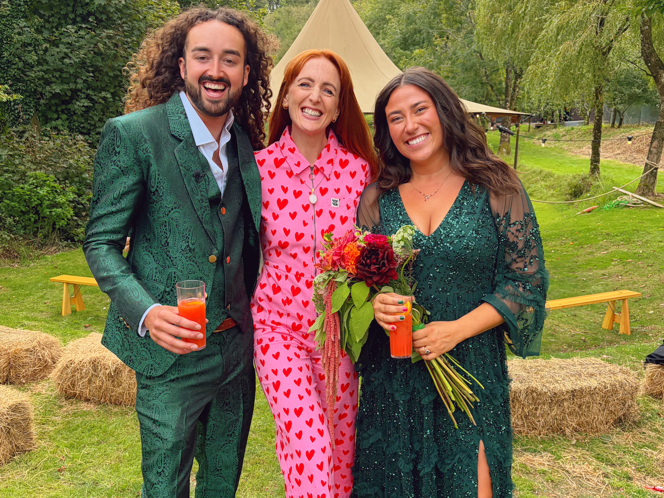 The Devon Celebrant stands with her two married clients in na beautiful outdoor wedding venue space