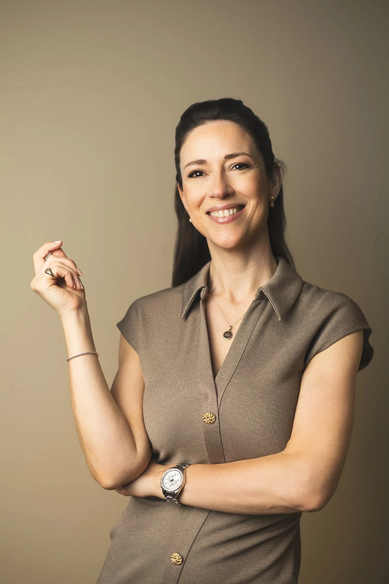 Portrait in brown dress against blue wall | Edge & Grace