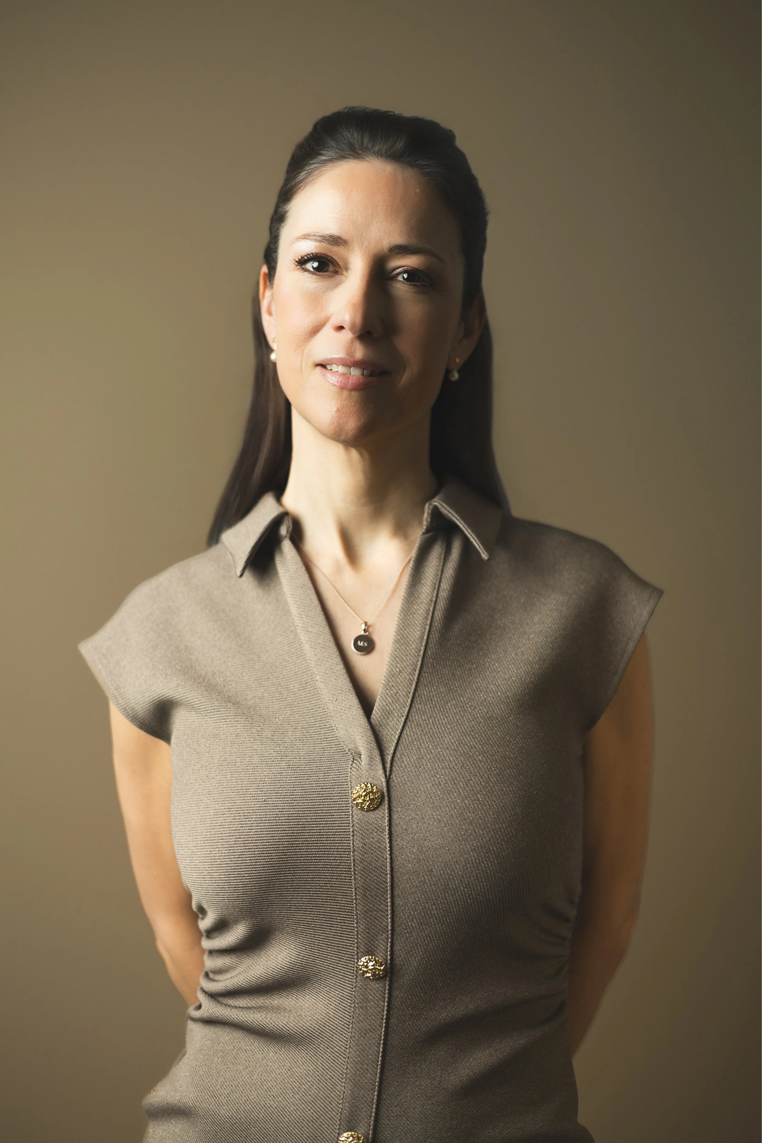 Portrait in brown dress against dark background | Edge & Grace