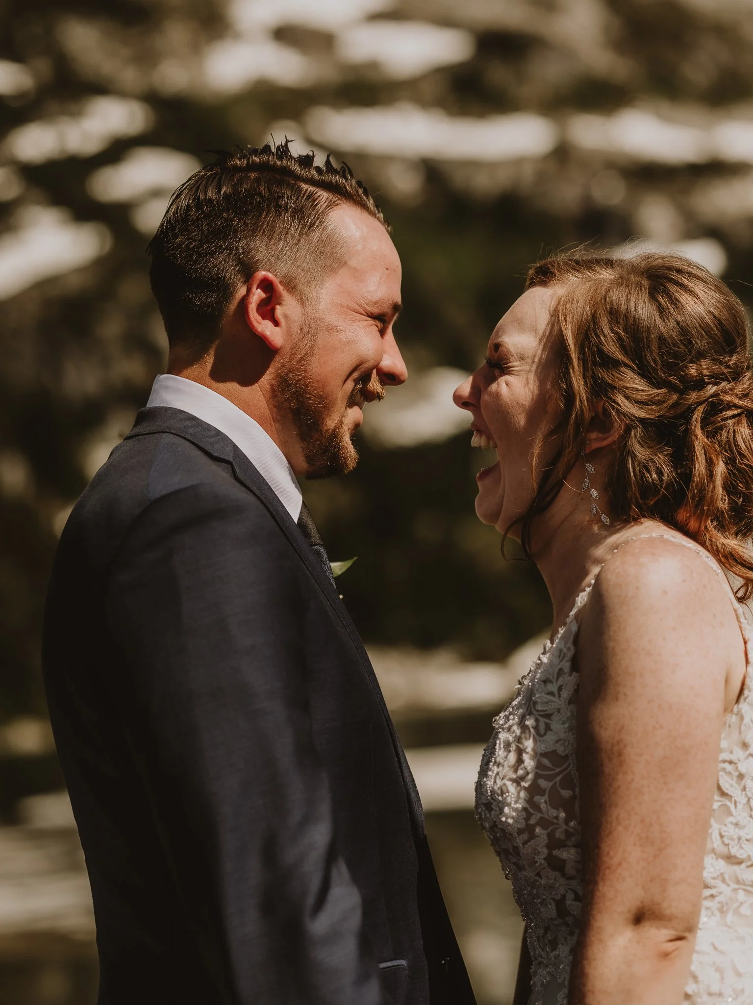 Couple laughing at one another after their intimate elopement in Nordegg, Alberta, photographed by Calgary & Alberta elopement photographer Shannon Boyd