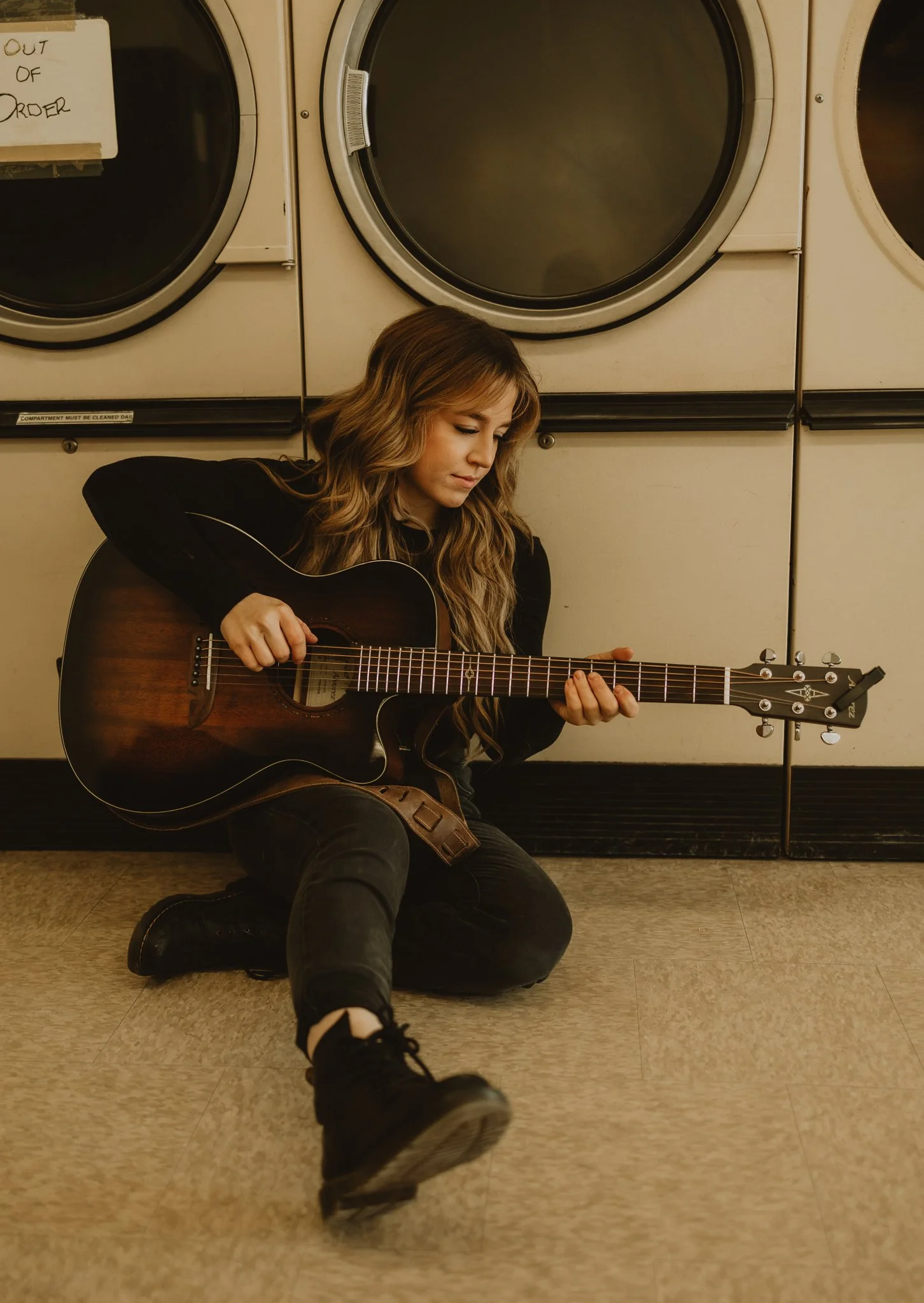 Young woman playing her guitar during a self-portrait lifestyle session in Westlock, Alberta, photographed by Calgary & Alberta lifestyle photographer Shannon Boyd