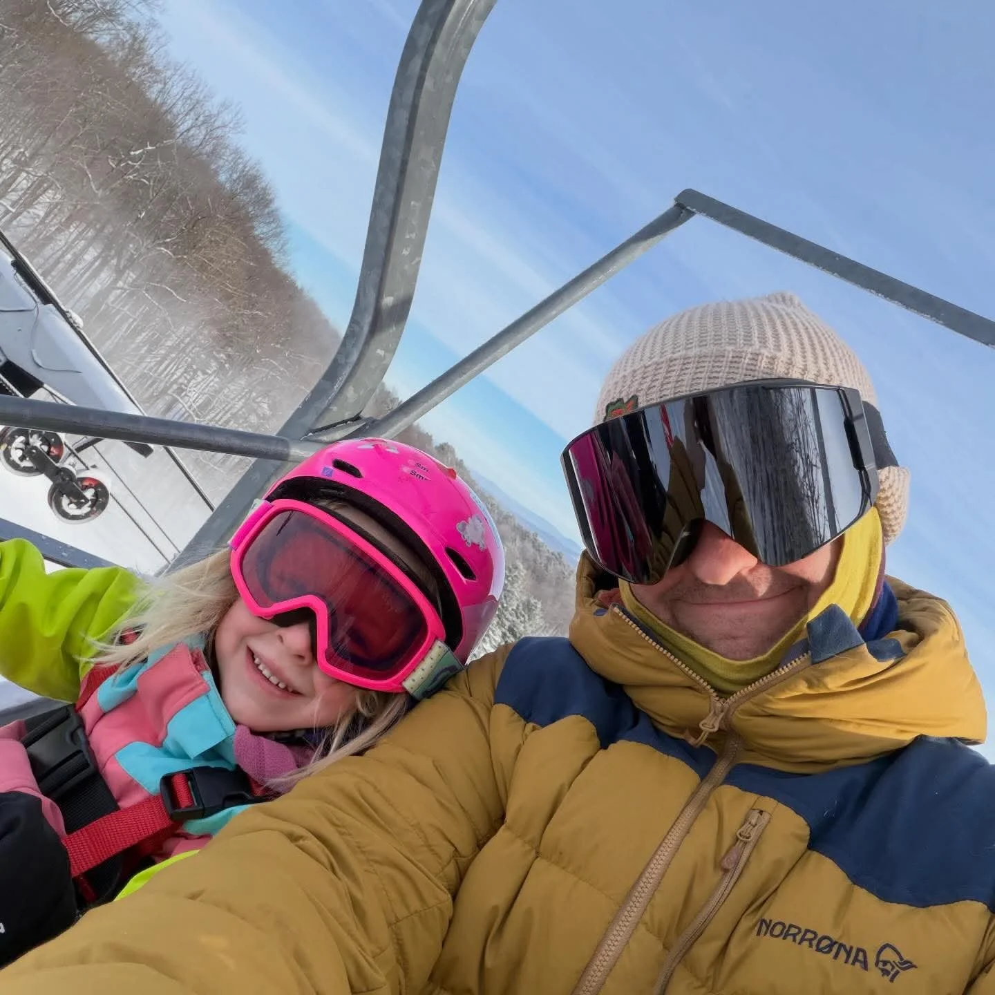 Father and Daughter are all smiles on a Willard Mountain chairlift
