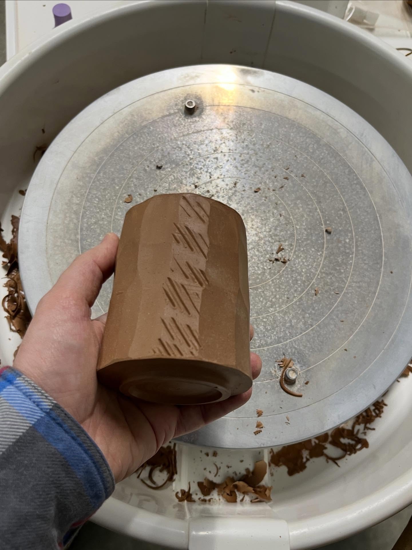 I usually prefer simple forms with clean lines, but lately I&rsquo;ve been really enjoying experimenting with adding texture. This is a handleless mug that I faceted with a potato peeler and scratched in some marking to give it a face/focal point. We