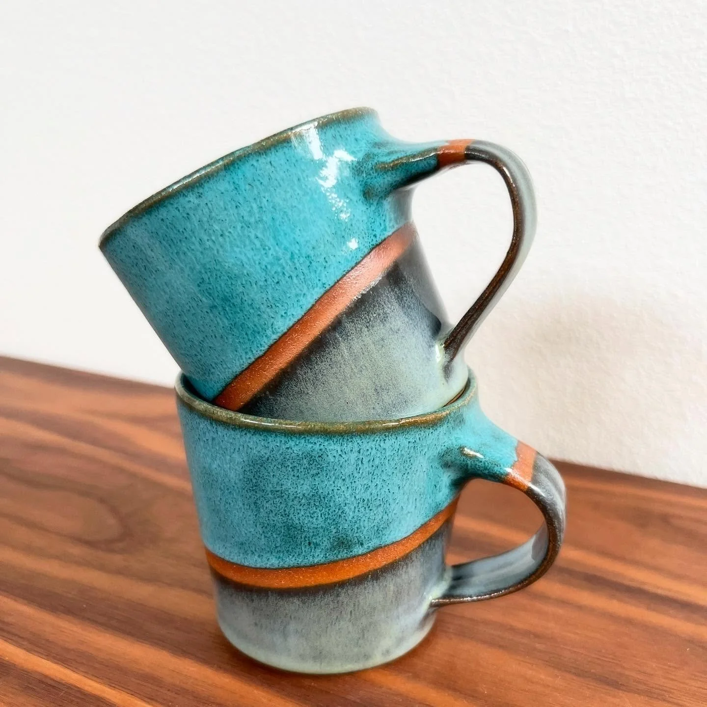 Little matching set of cappuccino cups! Teal Drift and Midnight Run with a little bit of exposed clay surface. 

#amacoglazes #ceramicmug #potterymug