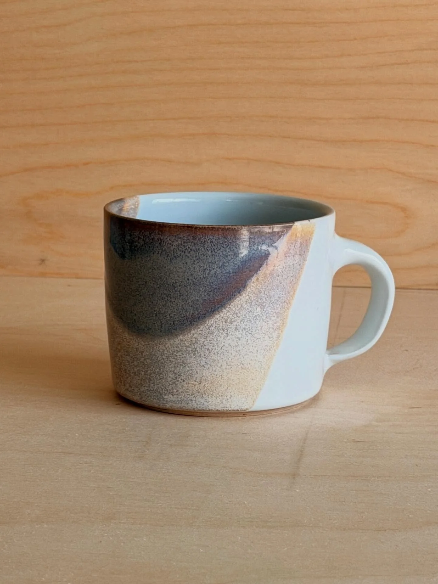 New mug day! A bit of a departure from the dark clay and moody glazes I&rsquo;ve been using lately, I made this pot with a smooth white, porcelain-like clay, and used Shiny White and Rutile Blue glazes from @eastsidepotshop. Shout out to @stanton.cer