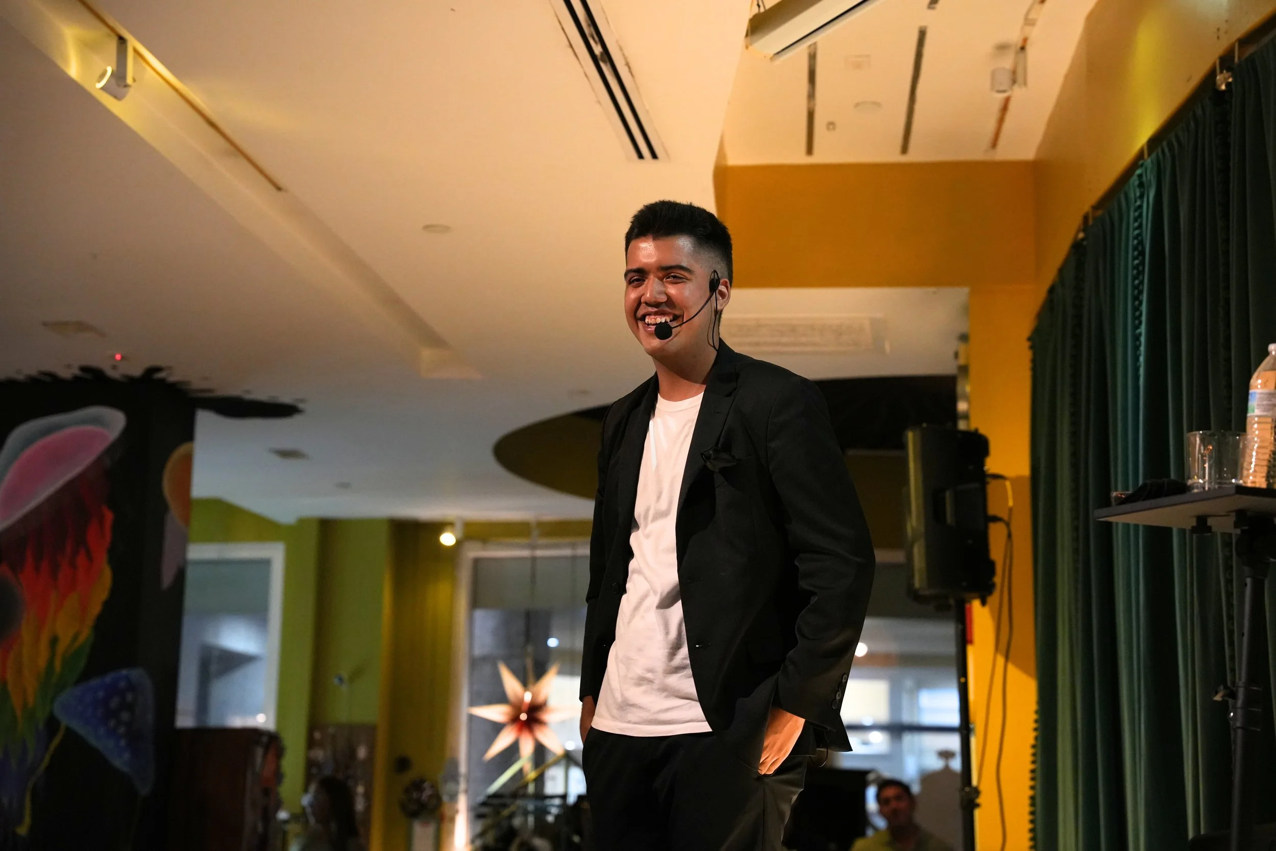 Live magic performance in Miami featuring a magician using everyday objects and engaging storytelling to connect with guests at a casual private event