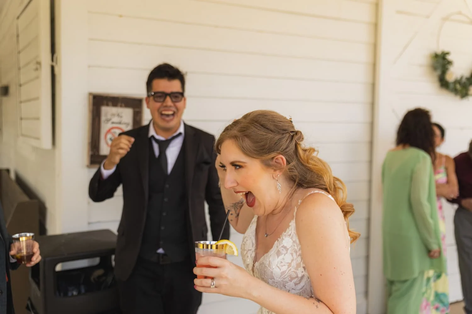 Miami wedding magician Daniel Sandoval performing close-up strolling magic for guests during a wedding cocktail hour.