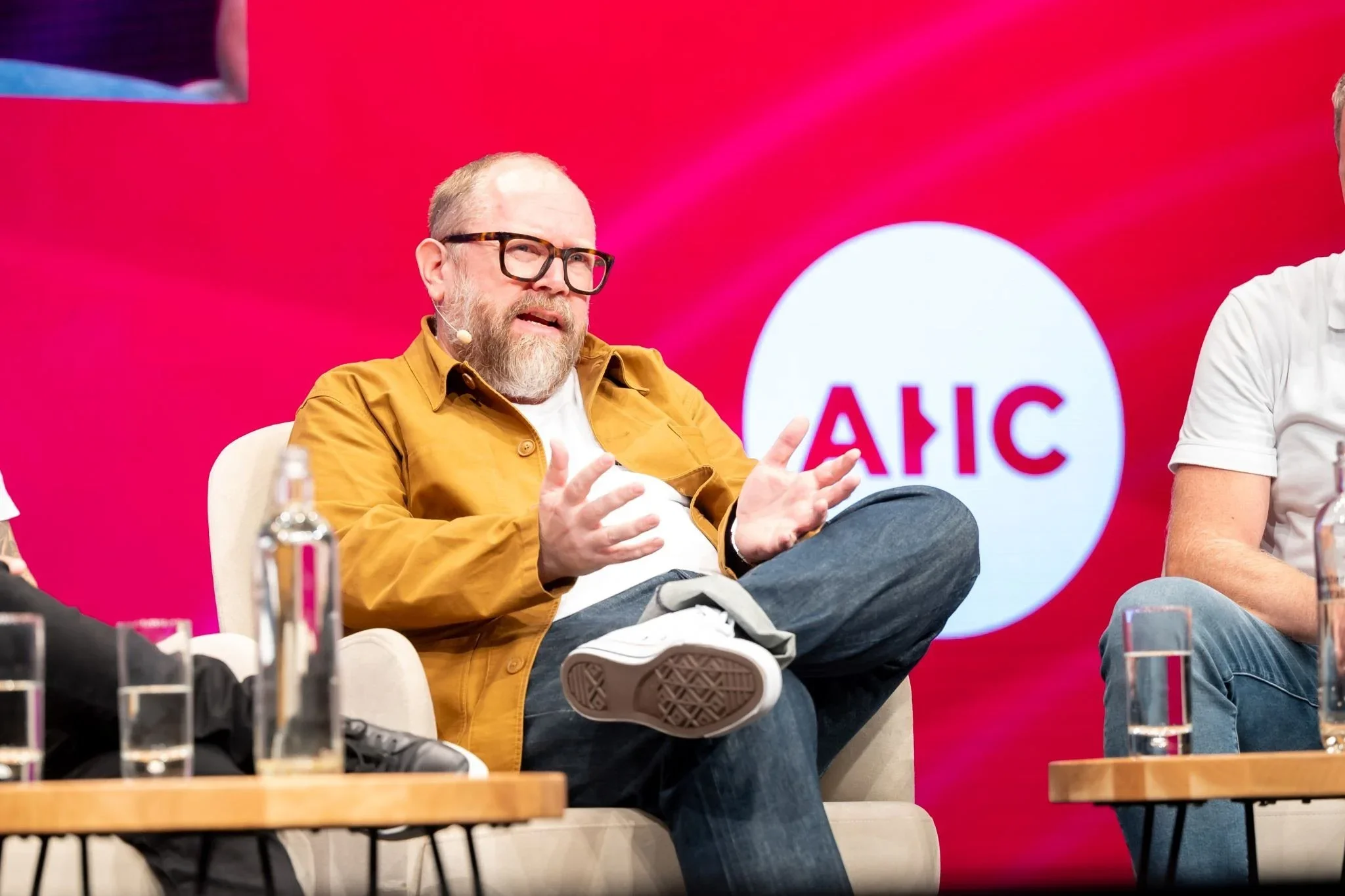 A photo of Simon Anderson on stage as a panellist.