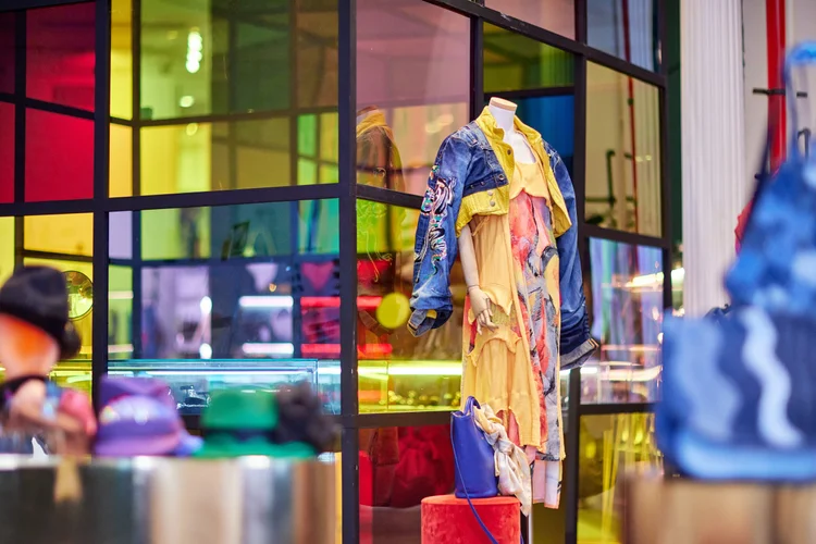Mannequin in a layered denim outfit in the boutique