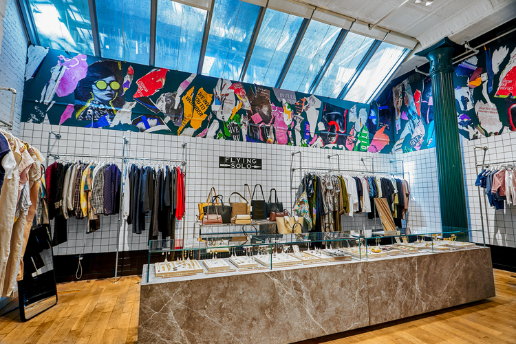 Retail floor with clothing, handbags and accessories