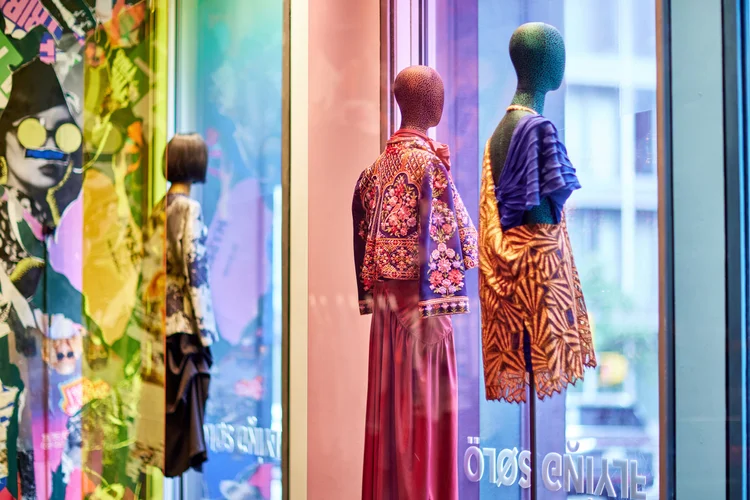 Storefront window display with styled mannequins
