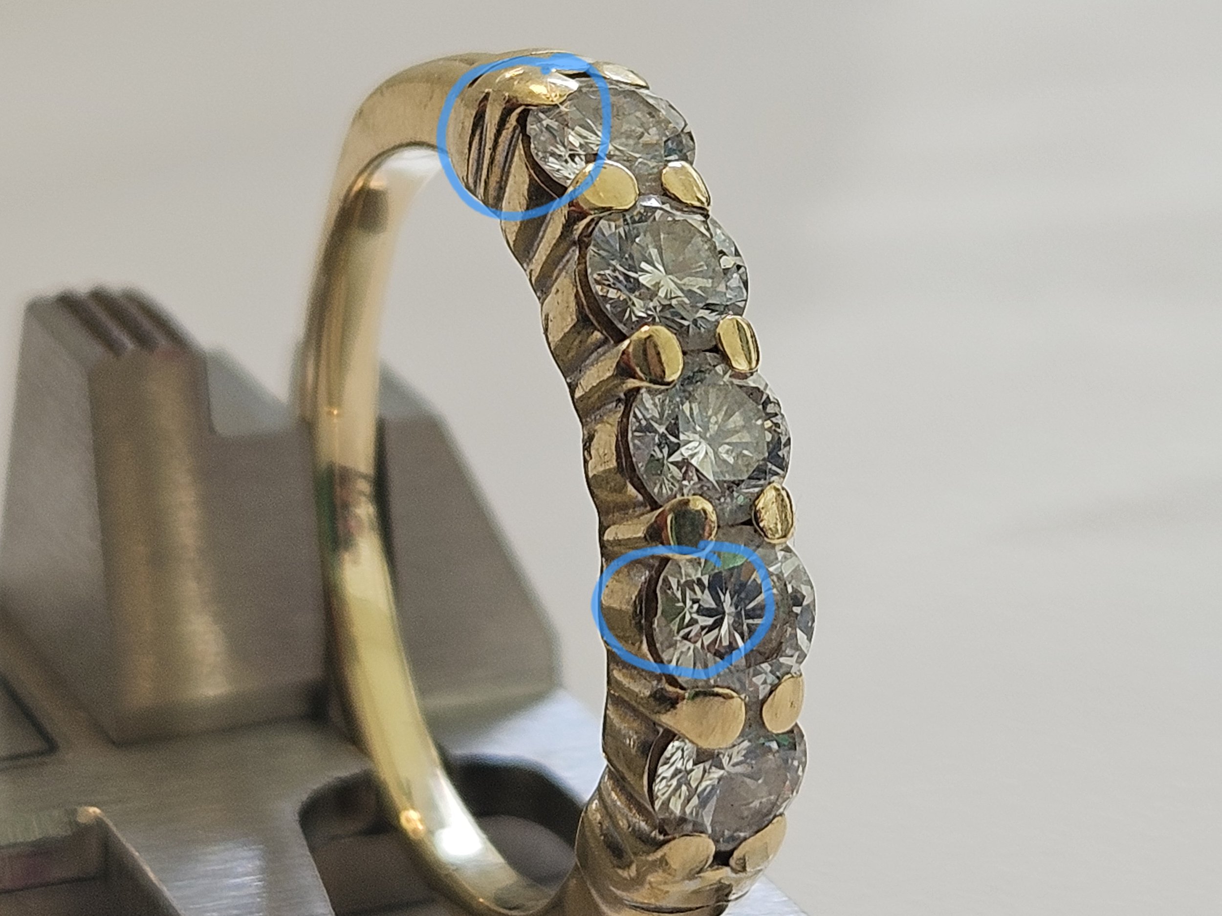 Anniversary band with worn down prongs
