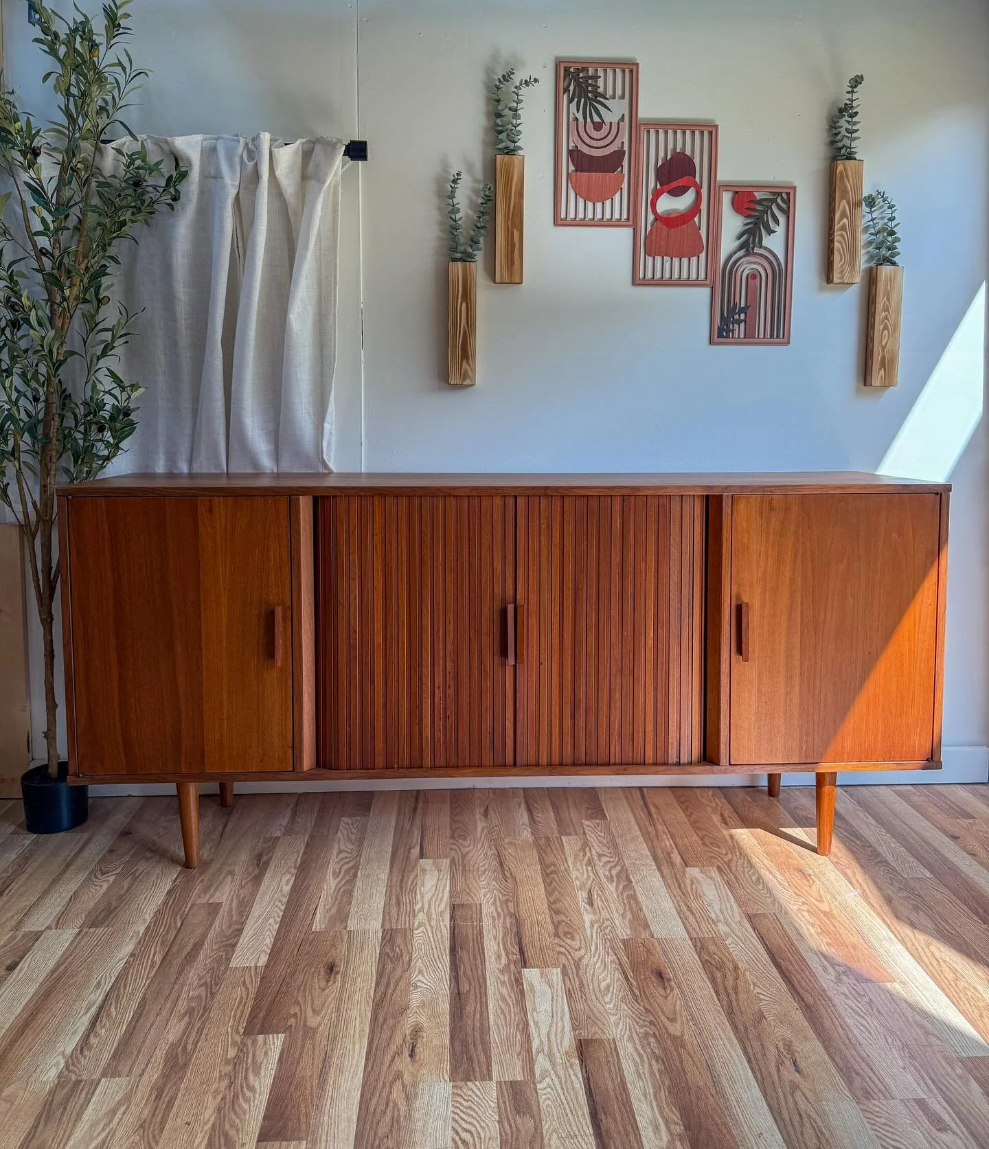 Mid century modern Mcm vintage Danish teak credenza/sideboard/buffet/tv stand. Super versatile piece that can fit anywhere in your home. Circa 1960&rsquo;s. This credenza features tambour sliding doors in the middle that expose open shelving, 3 pull 