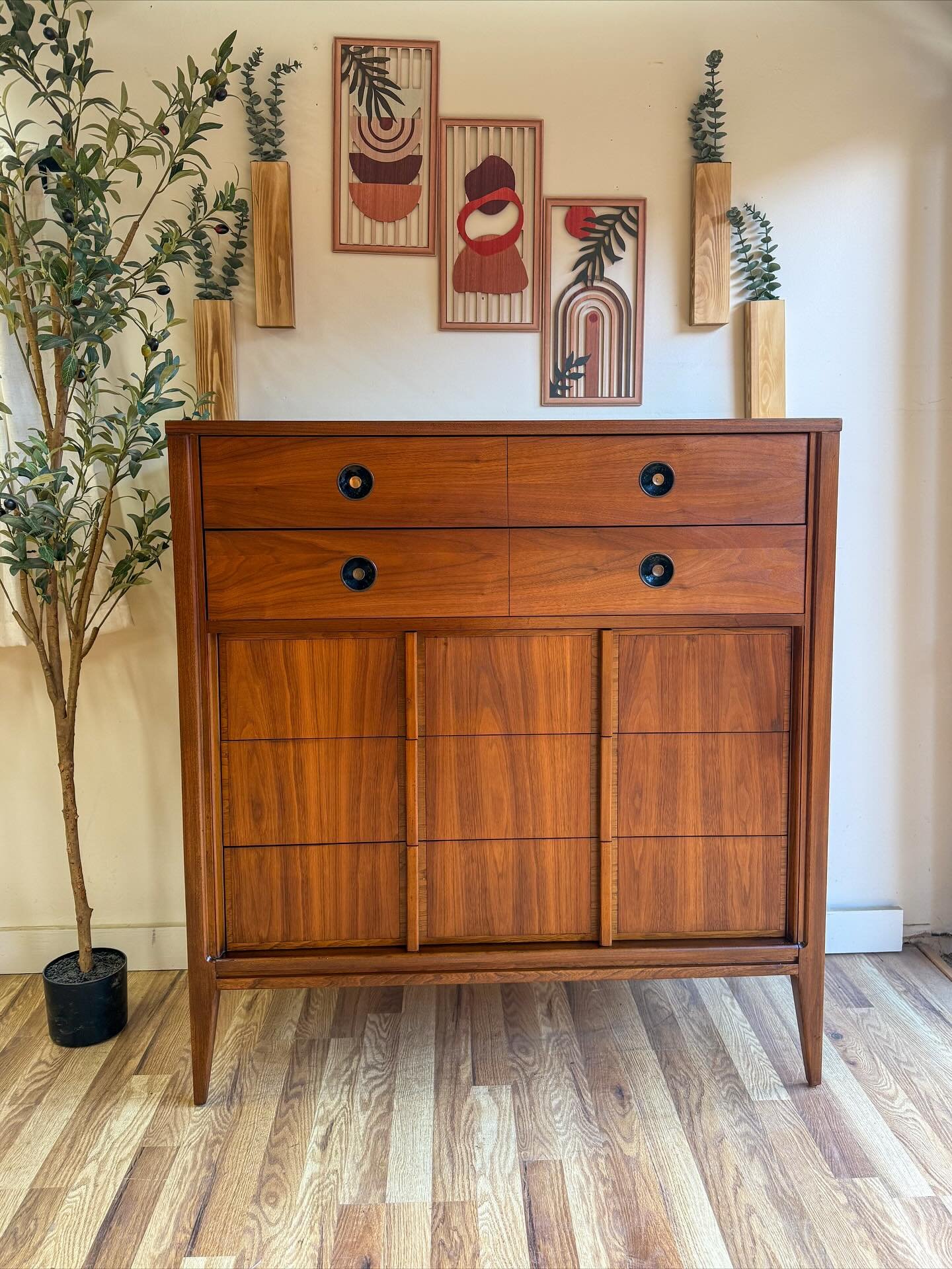 (SOLD) Mid century modern MCM vintage walnut 5 drawer tall dresser. Circa 1960&rsquo;s. Features beautiful walnut wood grains all throughout, 5 dove-tailed drawers that offer great storage and all slide well, and really unique brass &amp; black pulls