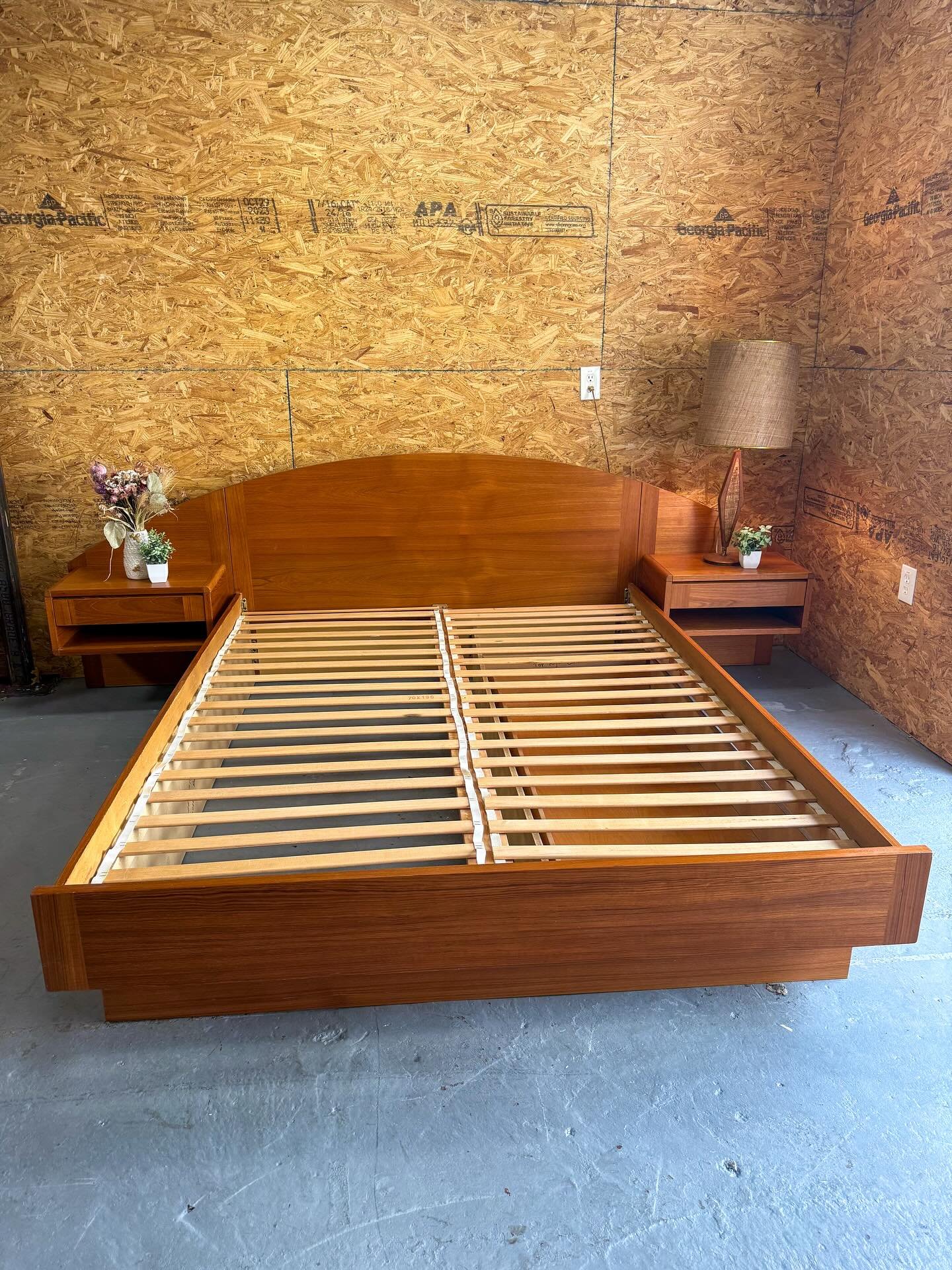 (AVAILABLE) MCM mid century Danish modern teak queen sized bed frame w/ two floating nightstands &amp; underneath rolling storage. This is the most beautiful teak bedframe I&rsquo;ve come across and the only one I&rsquo;ve seen locally with an &lsquo