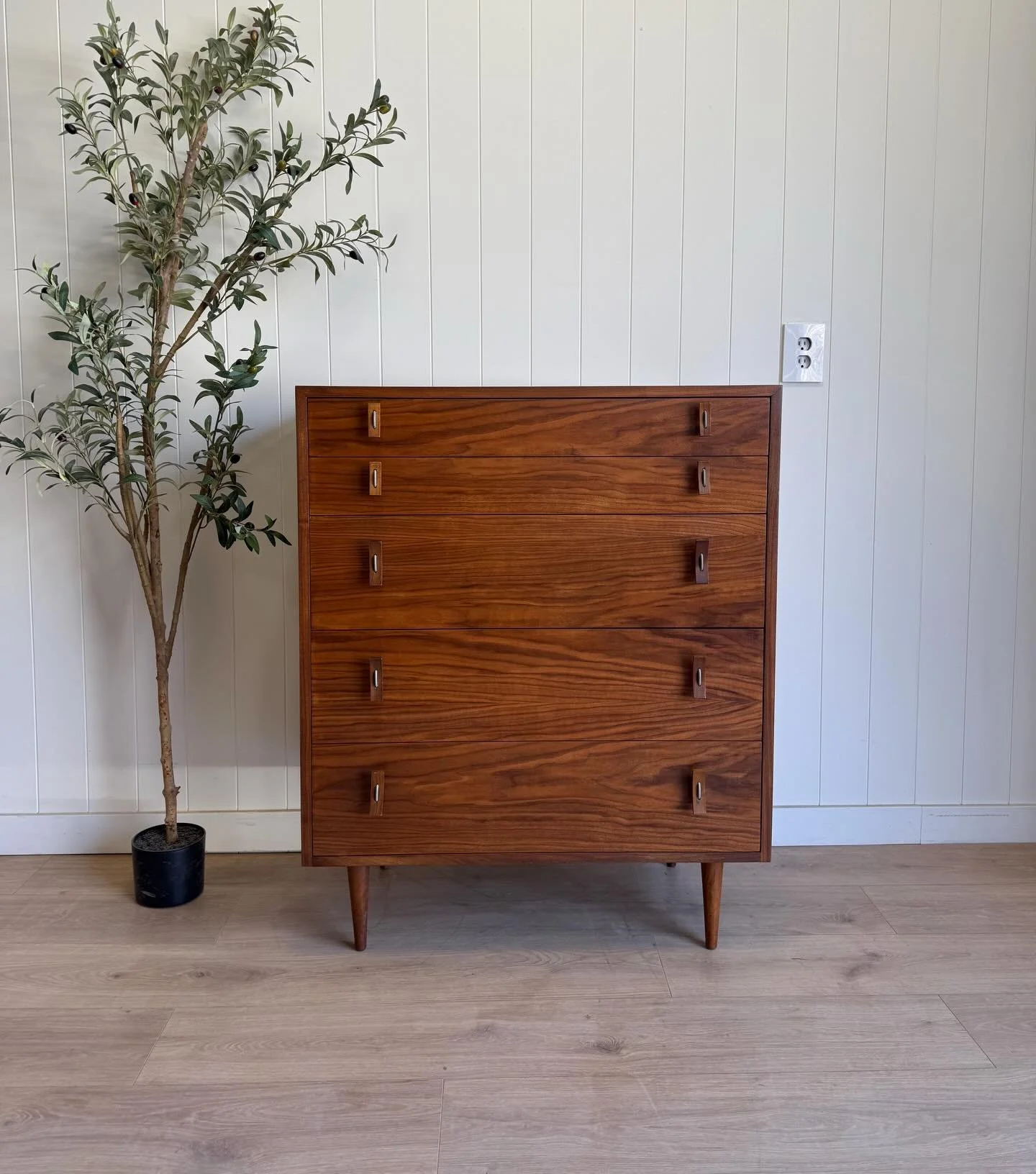 MCM mid century modern vintage walnut 5 drawer tall dresser by Stanley Young for Glenn of California, circa 1950&rsquo;s. This rare &amp; collectible dresser features beautiful walnut wood grains, 5 dove-tailed drawers, long tapered mid century legs,
