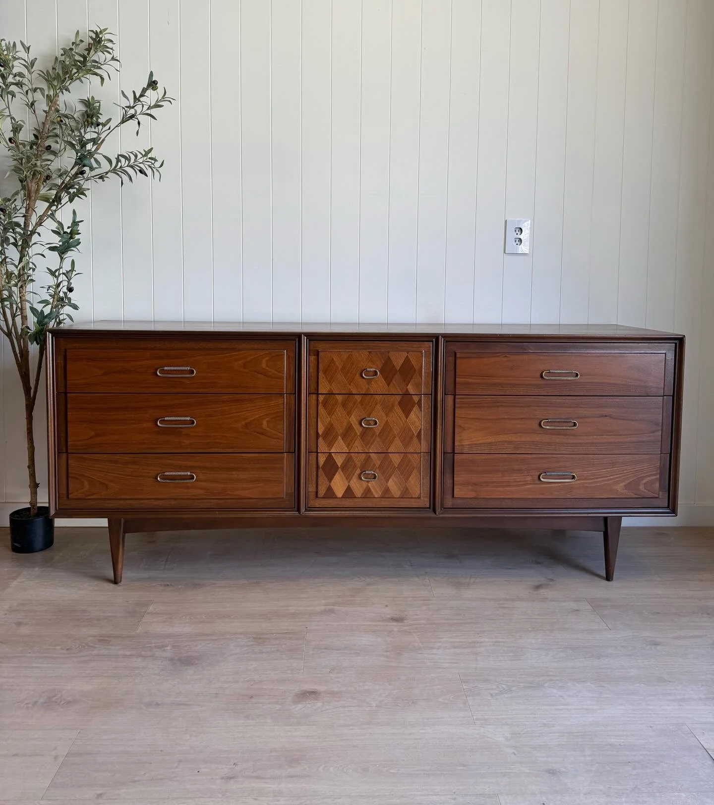 MCM mid century modern vintage walnut 9 drawer dresser. Circa 1960&rsquo;s. Features beautiful walnut wood grains, 9 dove-tailed drawers, original solid brass hardware, mid century tapered legs, and a really good multi-colored diamond front design to