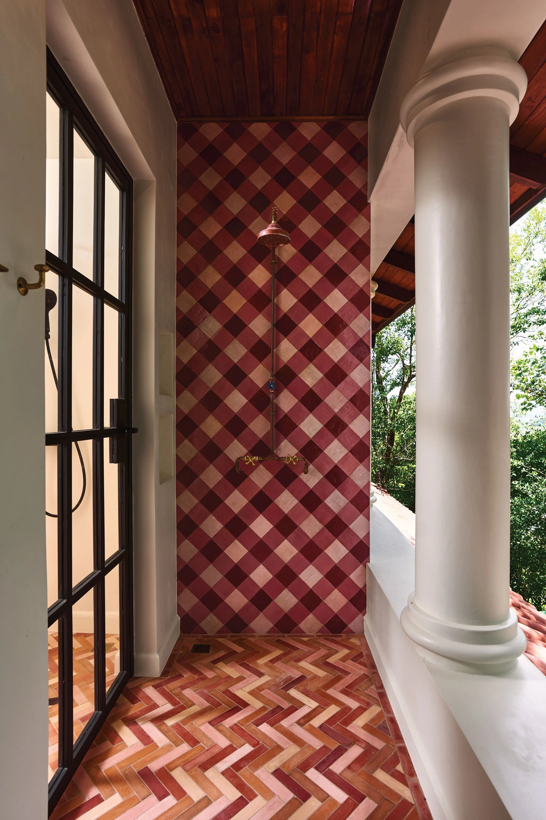 Pink and white checkered tile shower beside a garden view, Casa Ladera