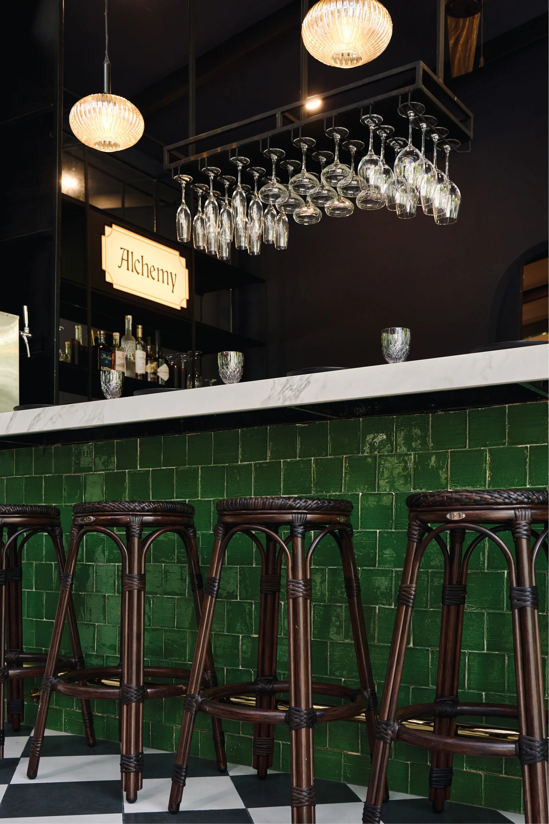 Green tiled bar with bentwood stools and café tables, Casa de Malka
