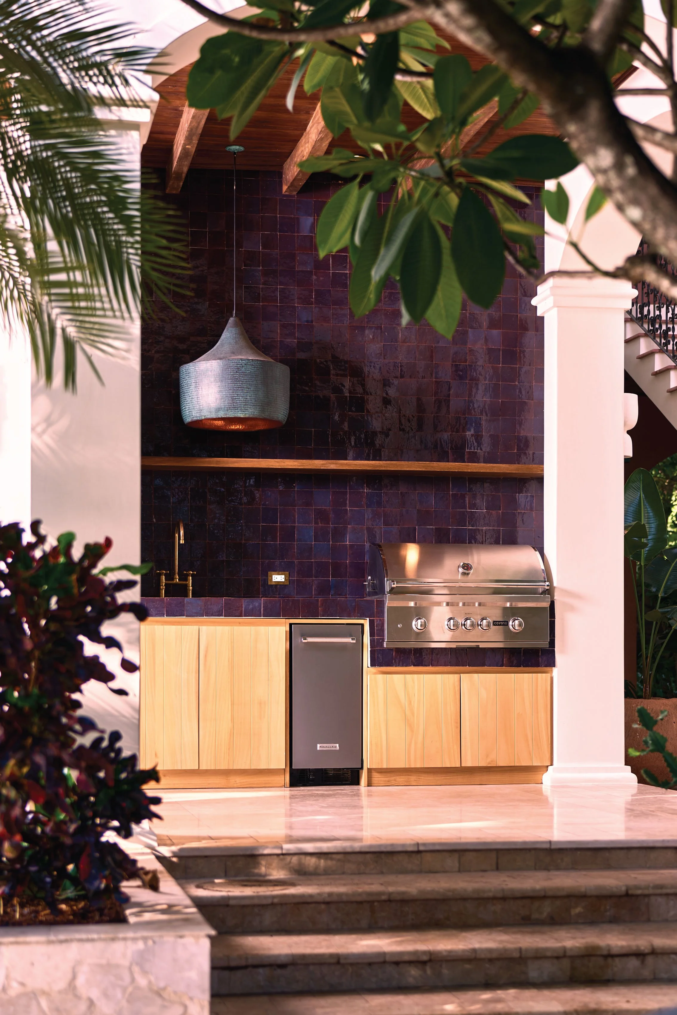 Outdoor kitchen with deep purple zellige tiles, wood cabinetry and a built-in grill, Casa Ladera