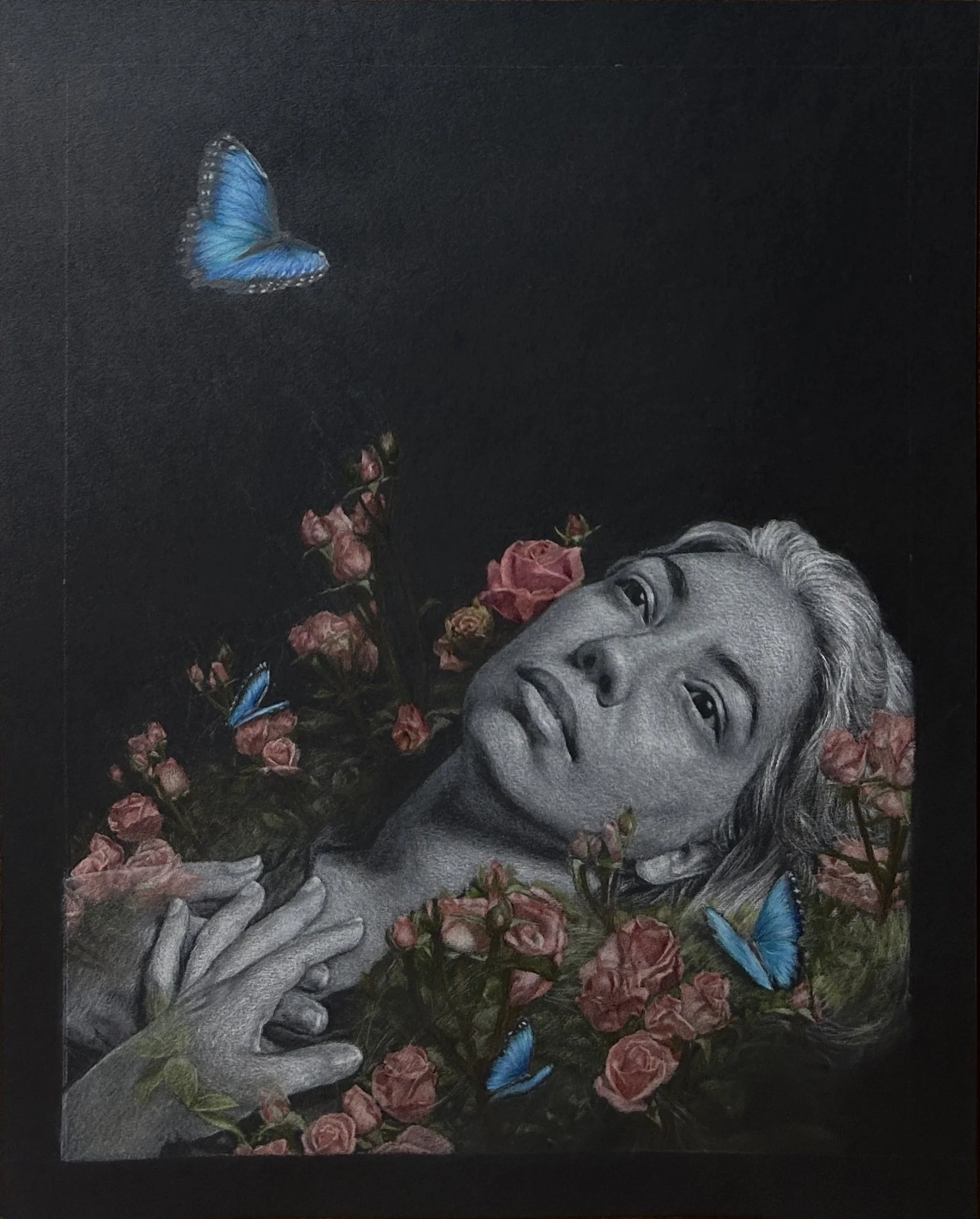 A drawing of a woman lying down on a bed of roses and blue butterflies.