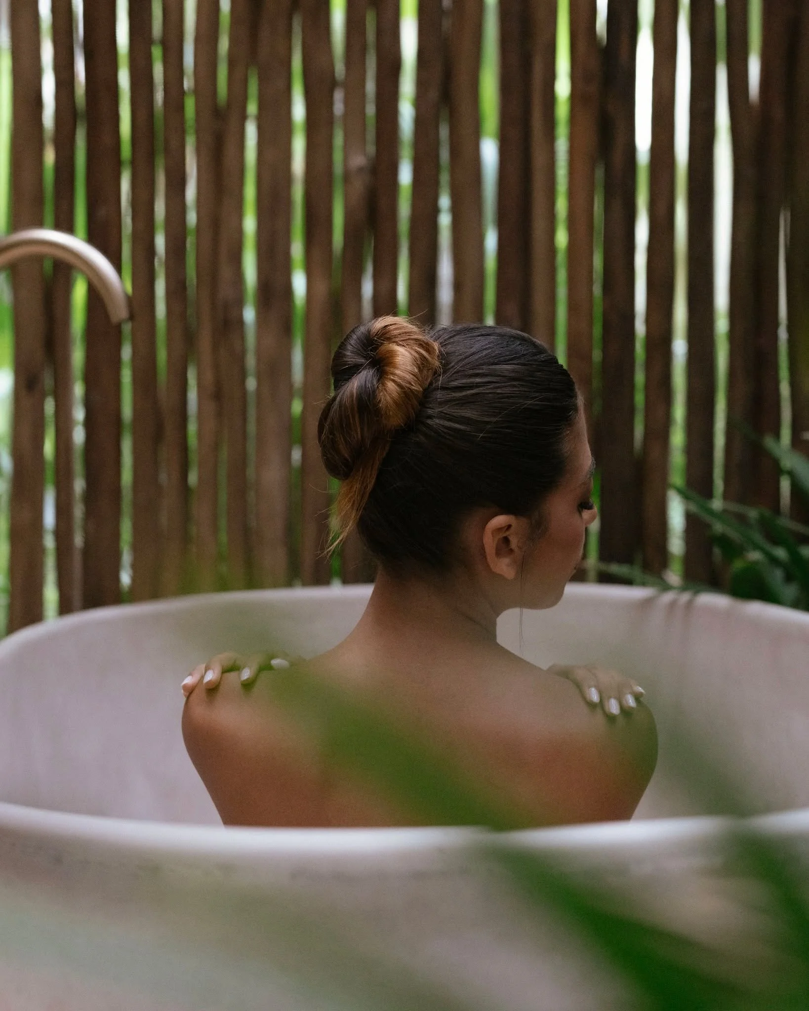 Jungle surrounding you softly.
Stillness held in warm water.
A ritual of quiet renewal.