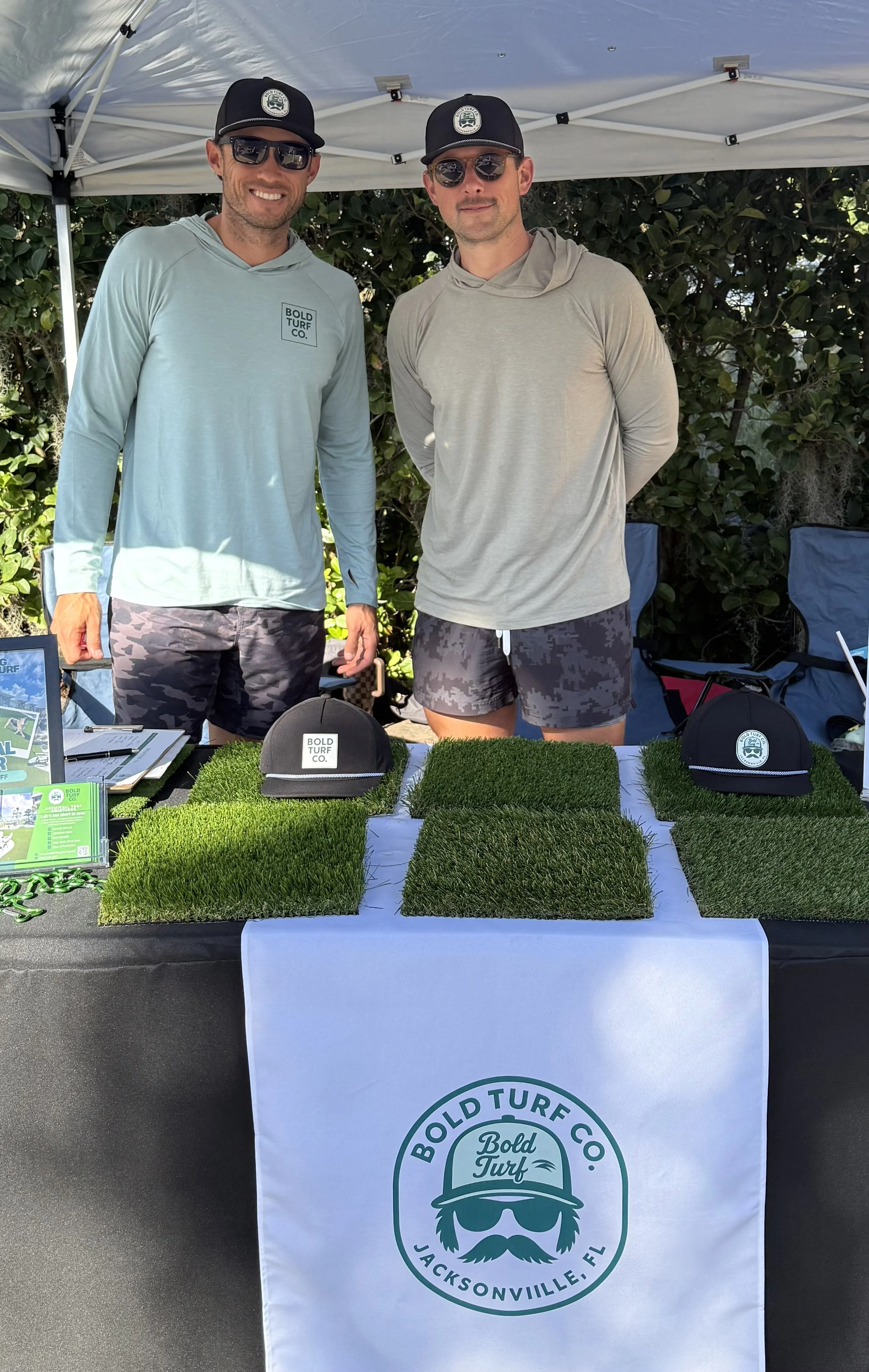 Matt and Ryan at trade show/event table Bold Turf Co owners Jacksonville artificial turf installers at local community event