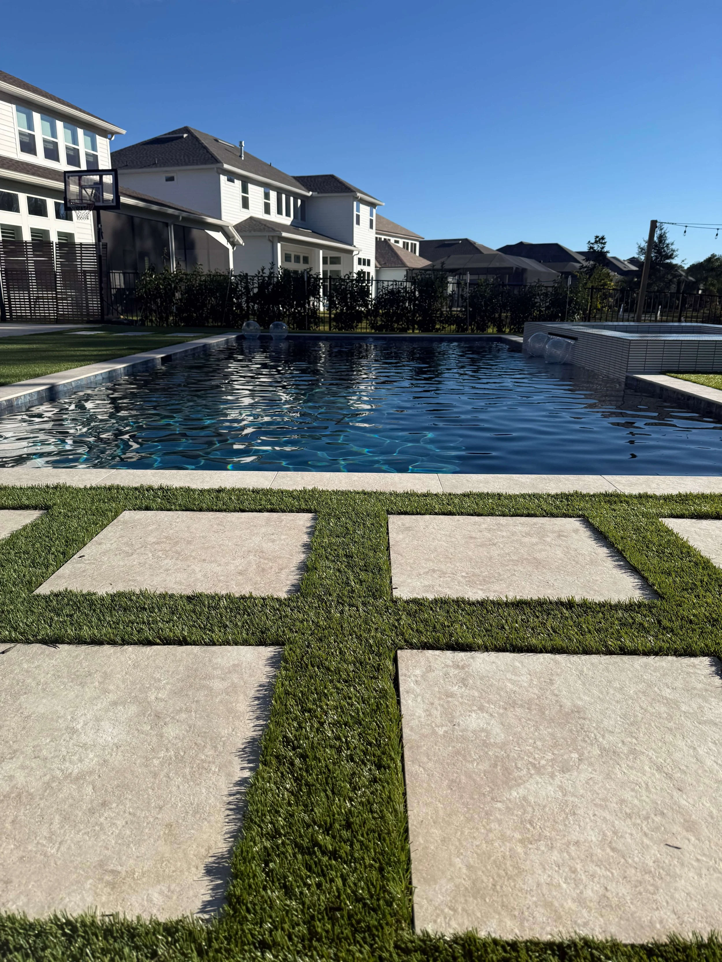 Residential artificial turf and concrete pool surround — Jacksonville FL