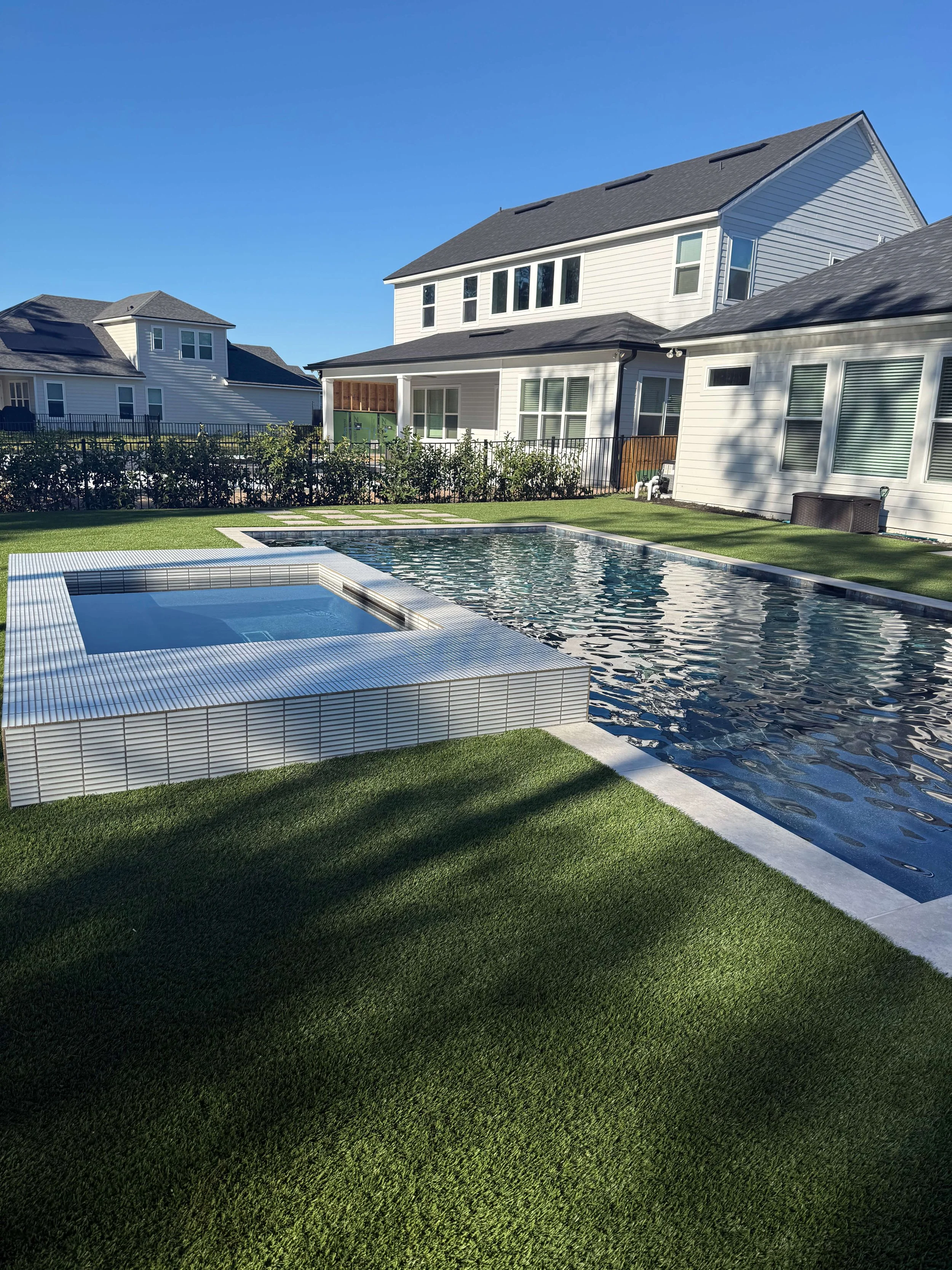 Artificial turf backyard with pool and hot tub — Bartram Park Jacksonville FL
