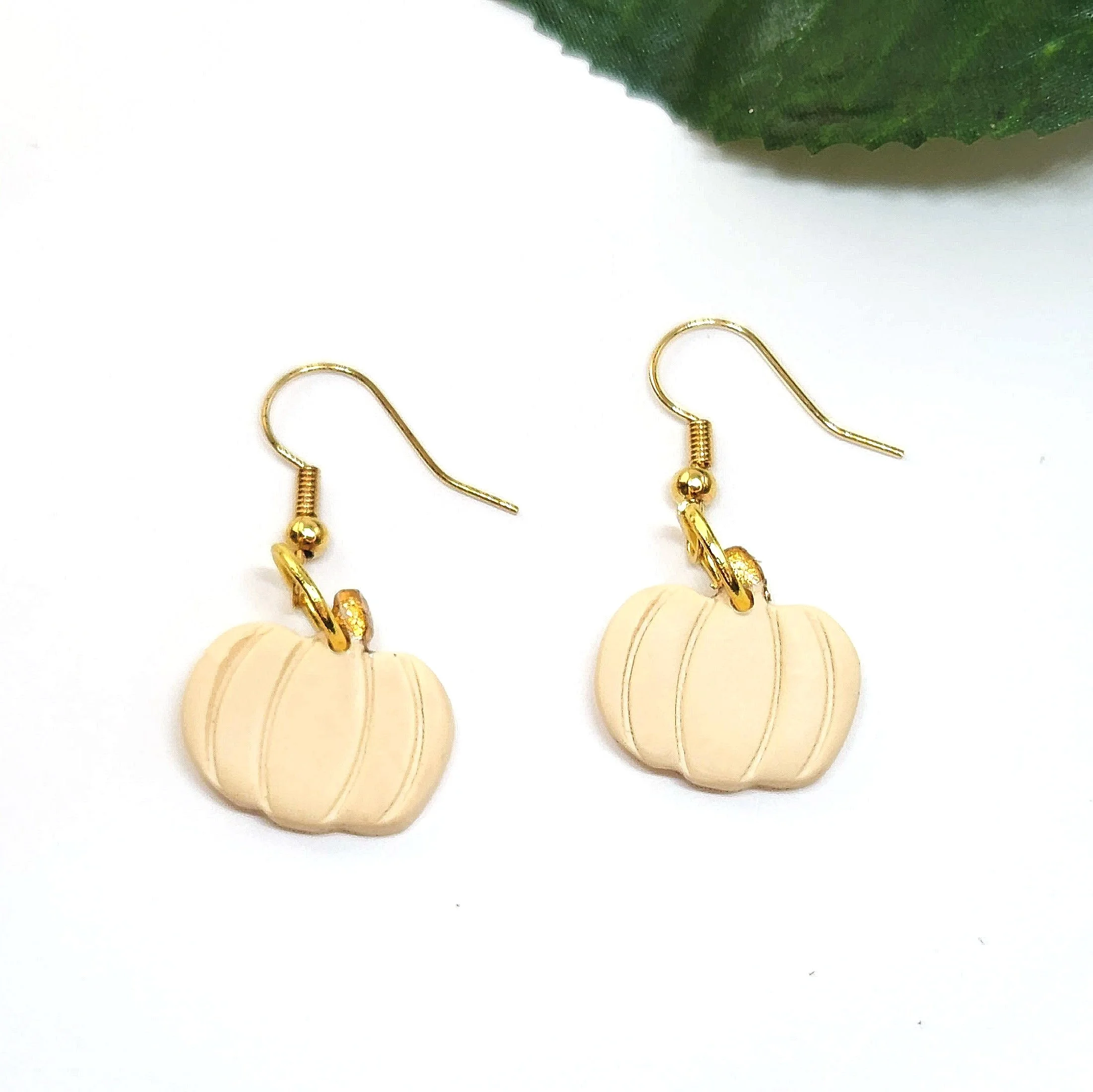 cream colored pumpkin dangle earrings