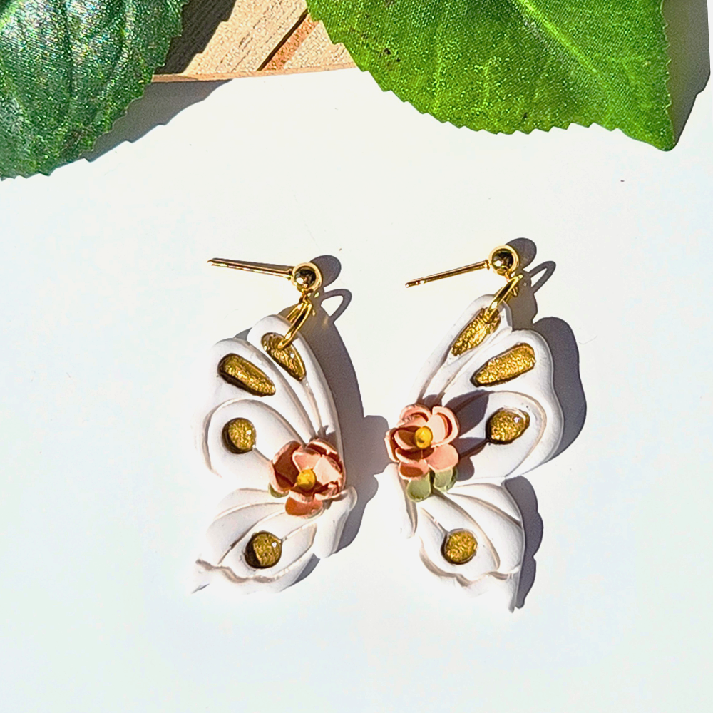 White+floral+Half+butterfly+earrings.png
