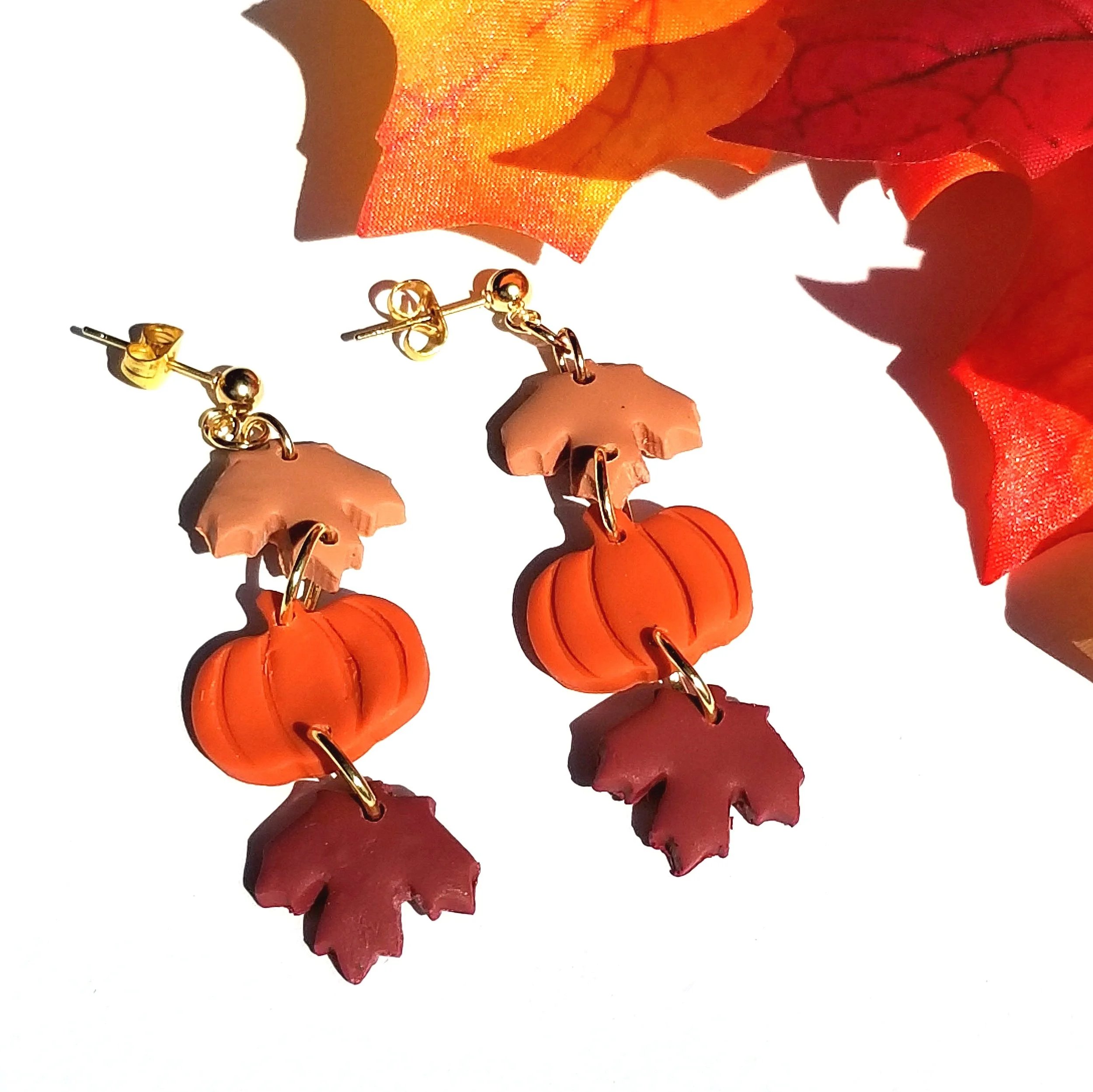 fall leaves alternating with a pumpkin earrings in orange and browns