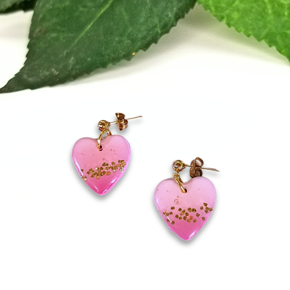 Pink Heart Dangles with gold sparkle.png