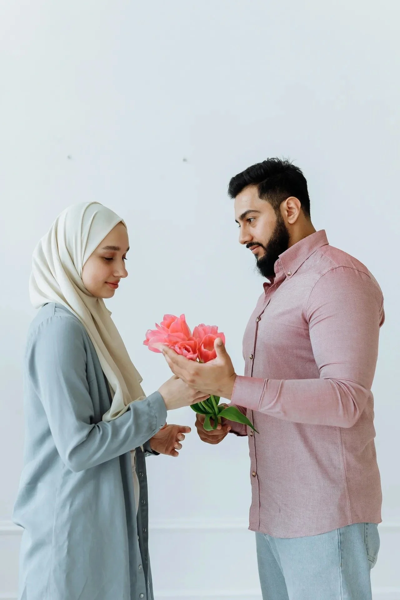 Couple man gives woman flowers