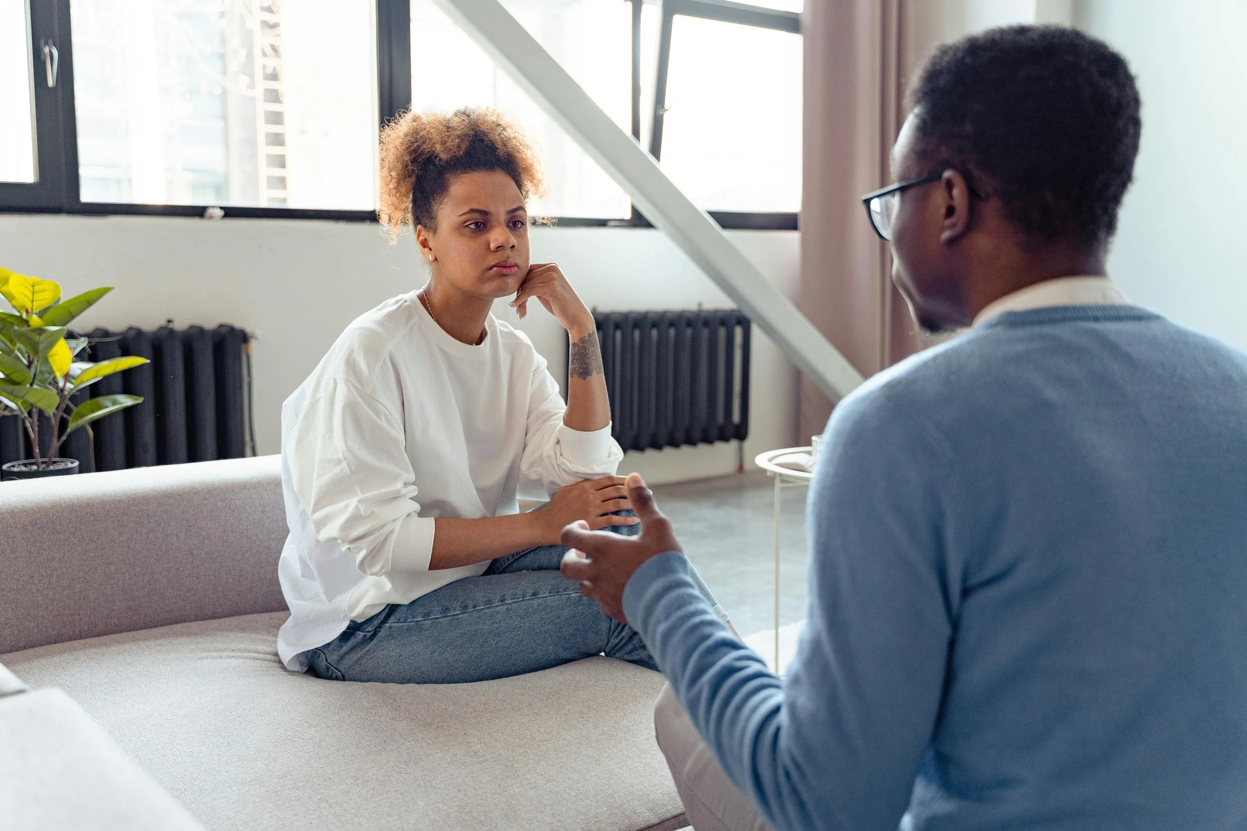 Woman listening during an intense conversation with a man