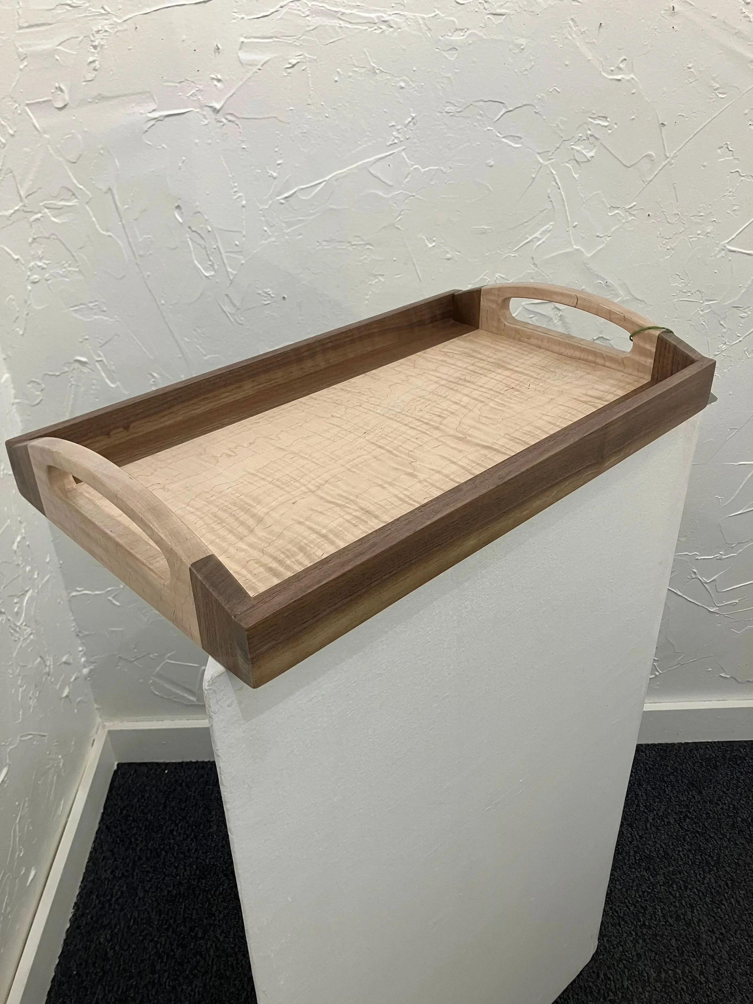 Serving tray made of walnut and curly maple. 