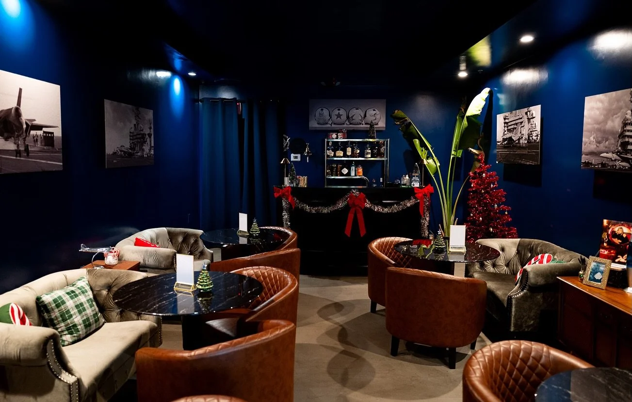 &lsquo;Tis the season for secrets and spirits so fine,
Where Christmas goes undercover and the cocktails align.

Slip through the shadows, where the navy once knew&mdash;
A Prohibition Christmas dressed in vintage and blue.

Settle by the fire pit, w