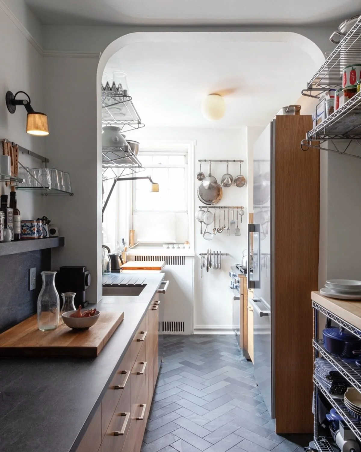 Still one of my favorite kitchens, a design for a friend and excellent cook.  The material palette is minimalist so that the display of cookware are pantry goods can be maximalist.  Galley kitchens can serve even the most accomplished chefs.  Photo b