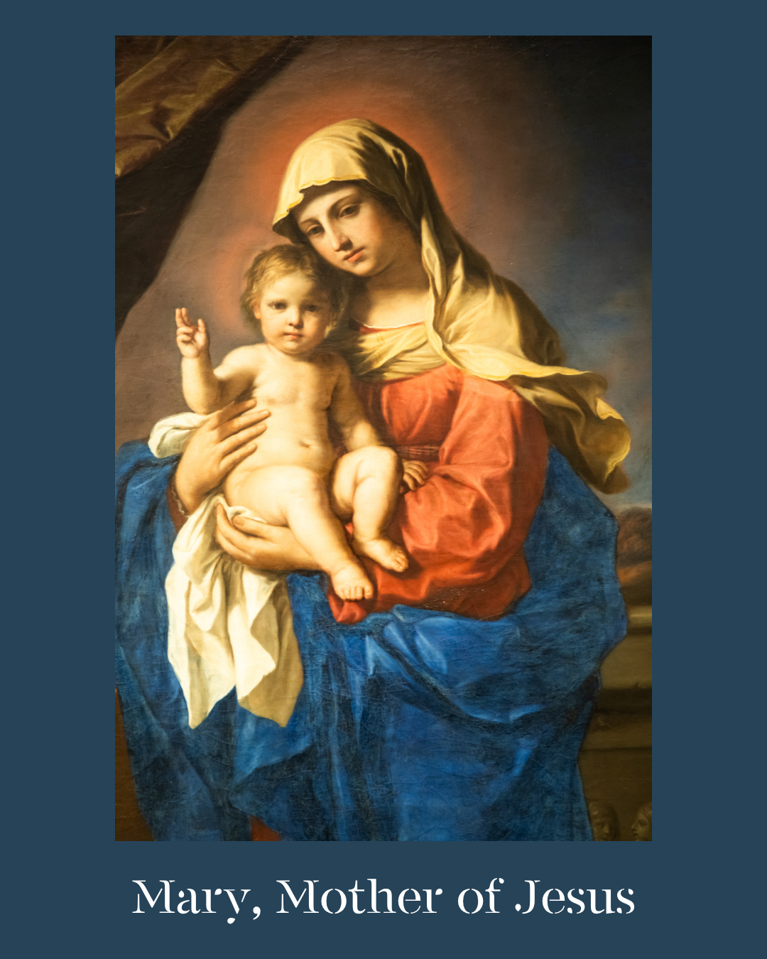 Mary holding Baby Jesus in her arms as he gives the sign of peace.