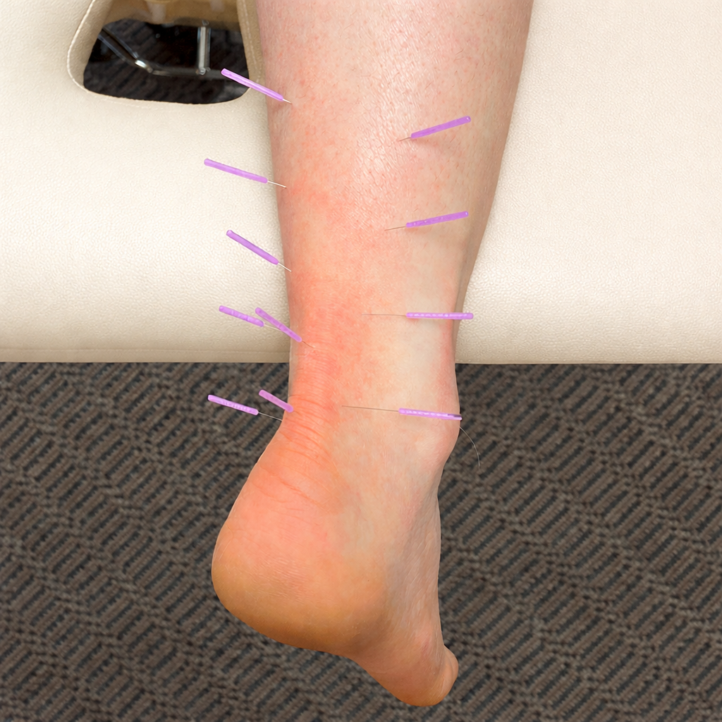 A man receives an injection in his upper arm from a healthcare professional wearing a blue shirt.