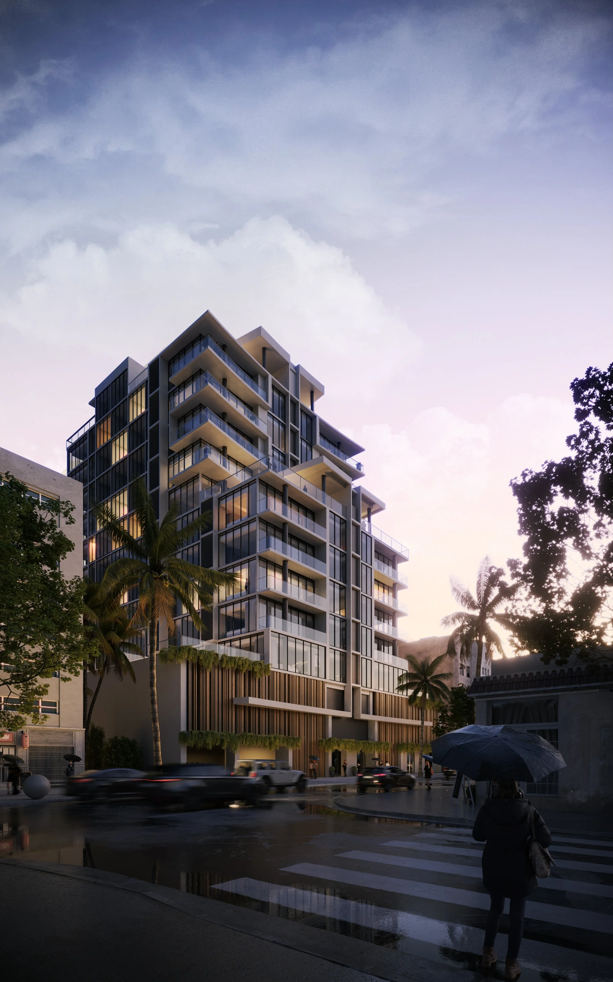 Modern multi-story residential building with glass balconies and palm trees in front, street scene with people and cars, rainy weather with puddles and an umbrella.