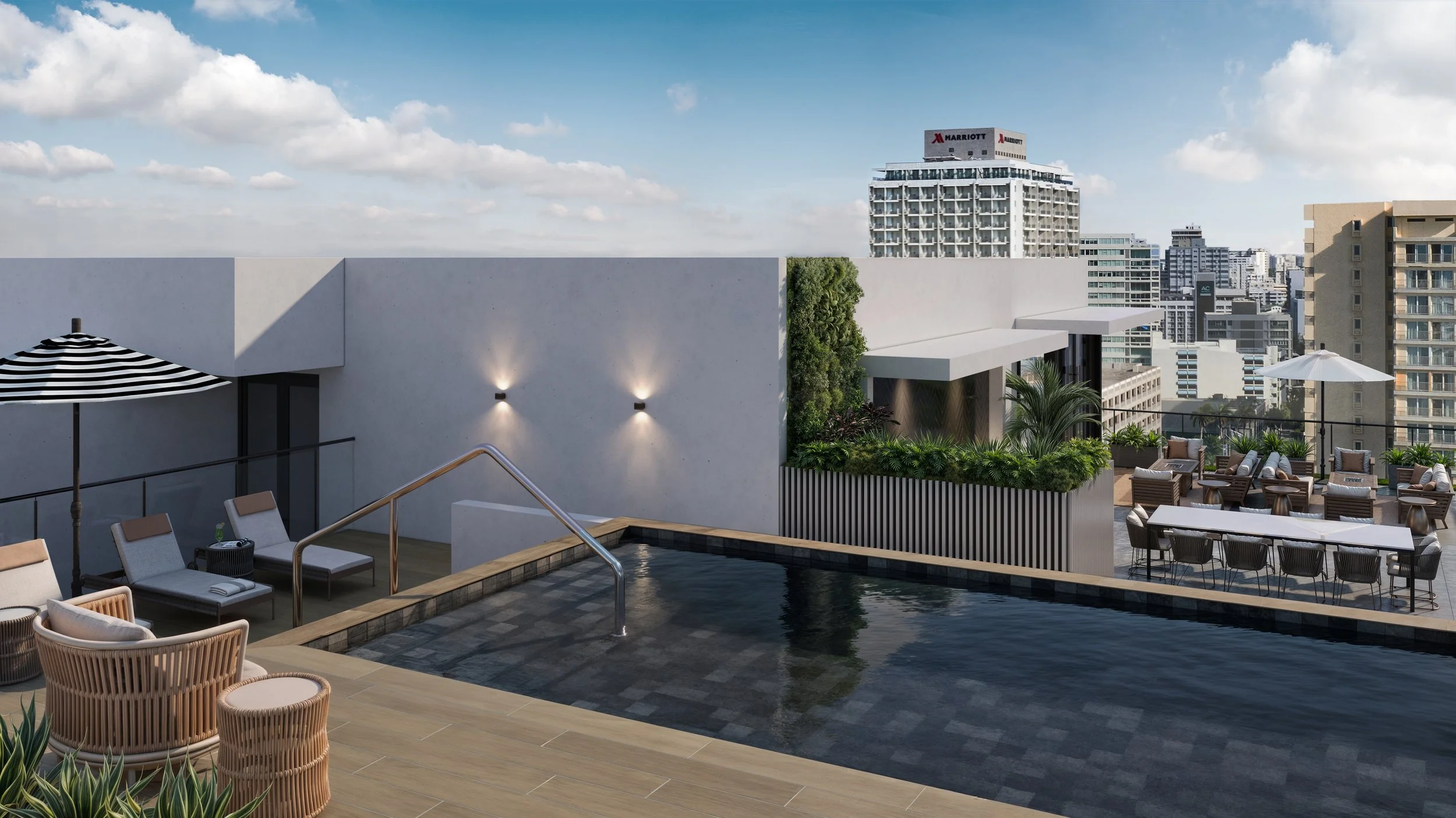 Rooftop pool area with lounge chairs, umbrellas, and city skyline in the background.